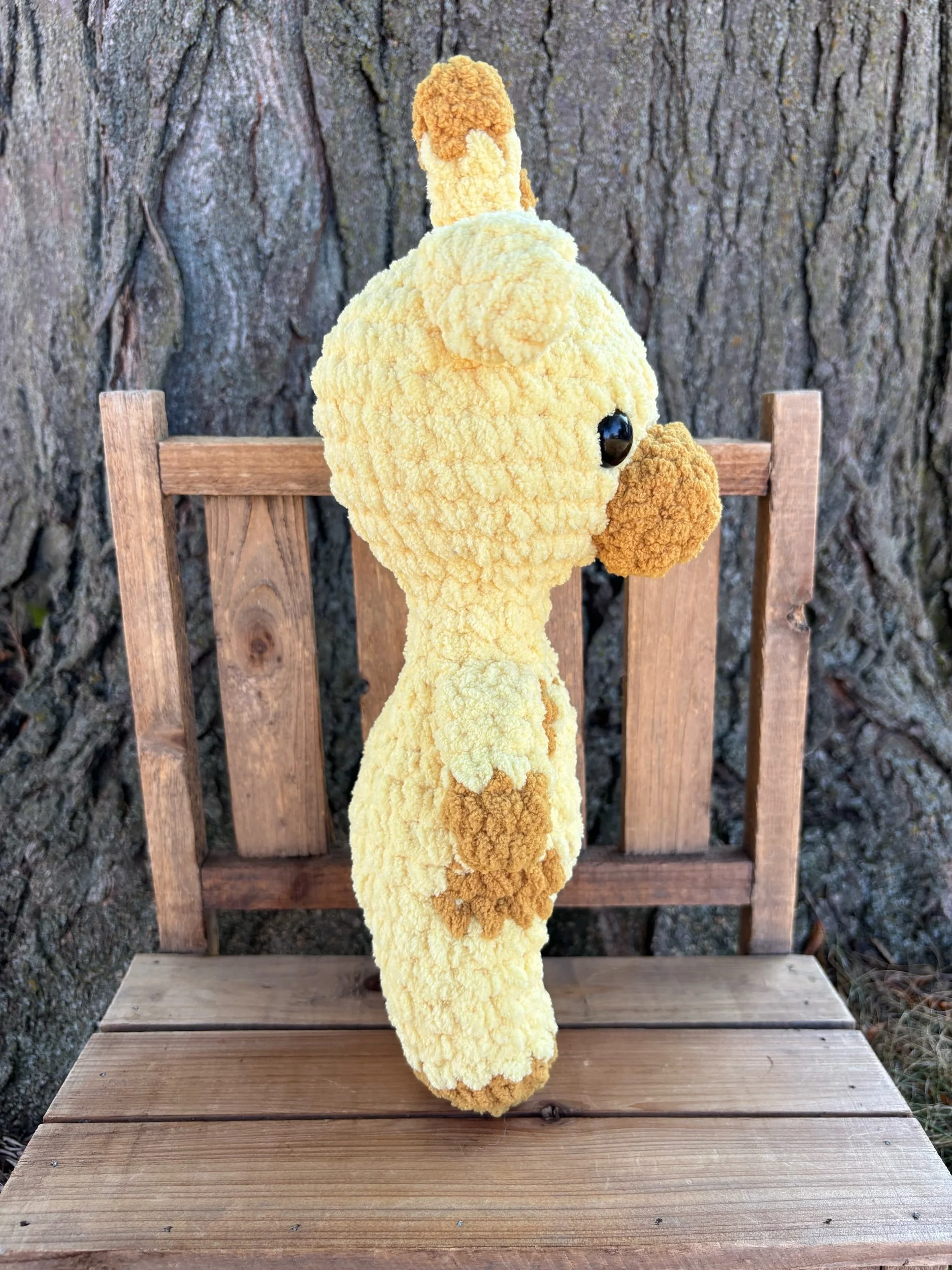 Handmade crochet giraffe plushie with tan spots