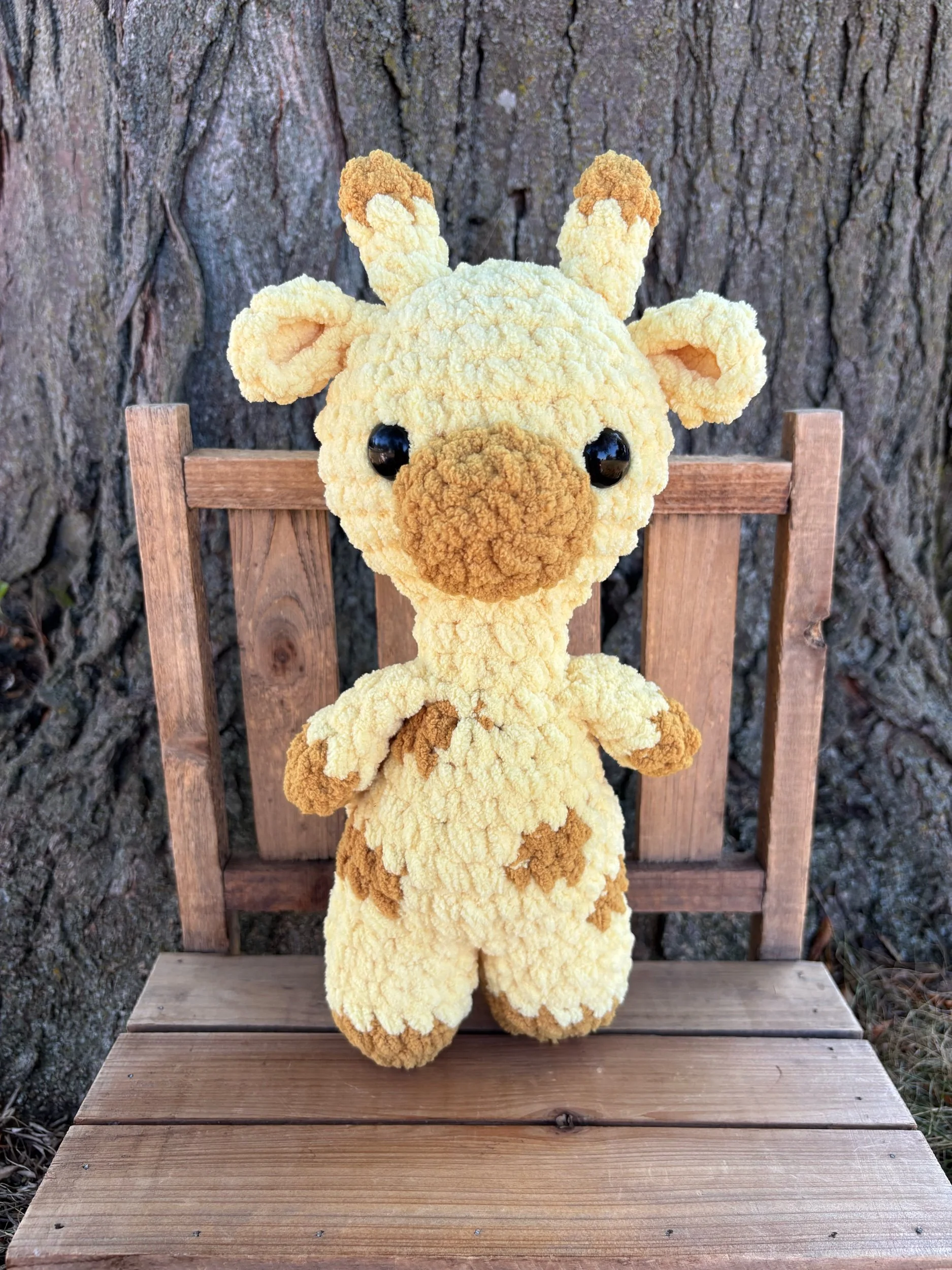 Handmade crochet giraffe plushie with mustard spots