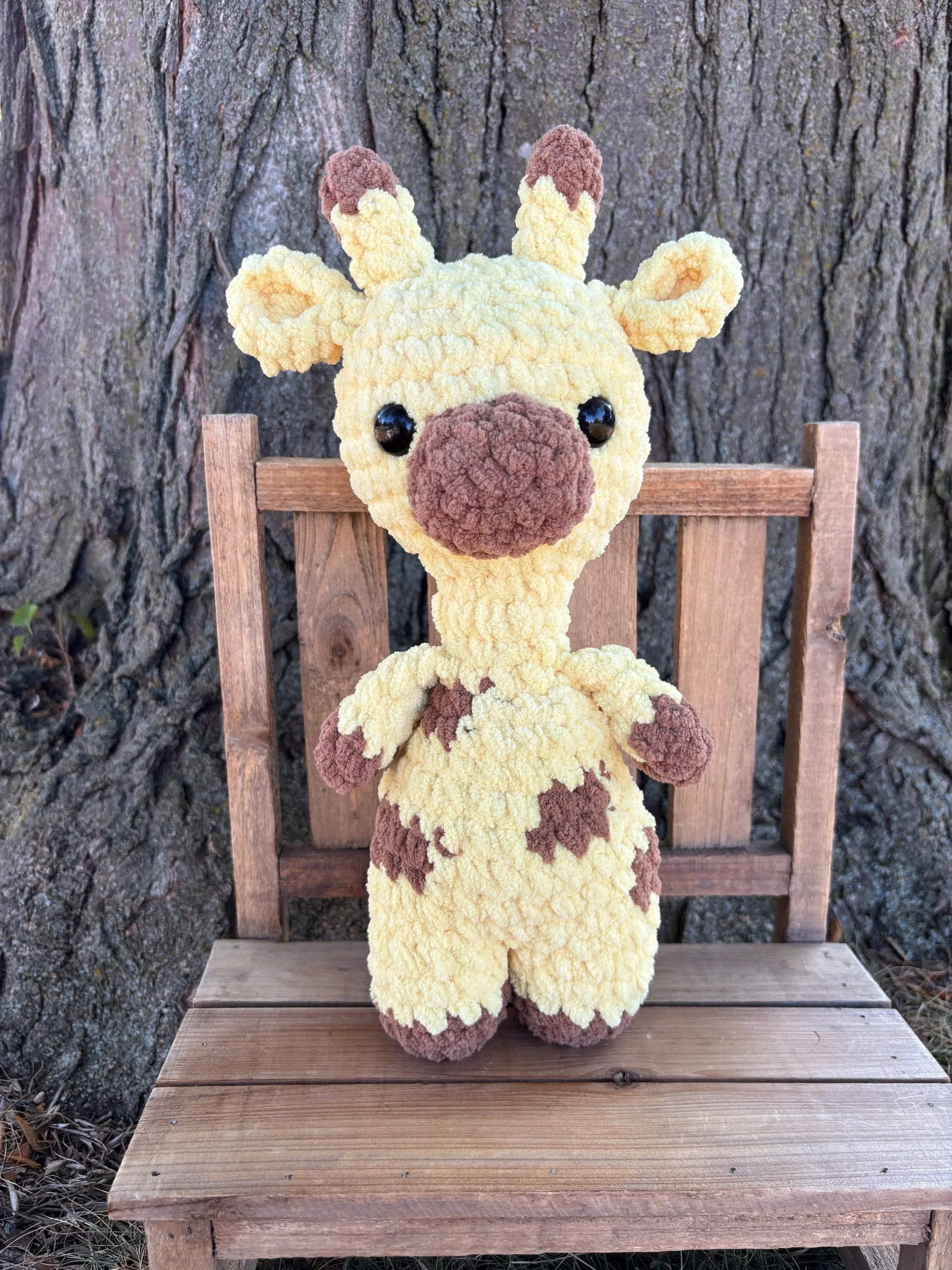 Handmade crochet giraffe plushie with brown spots