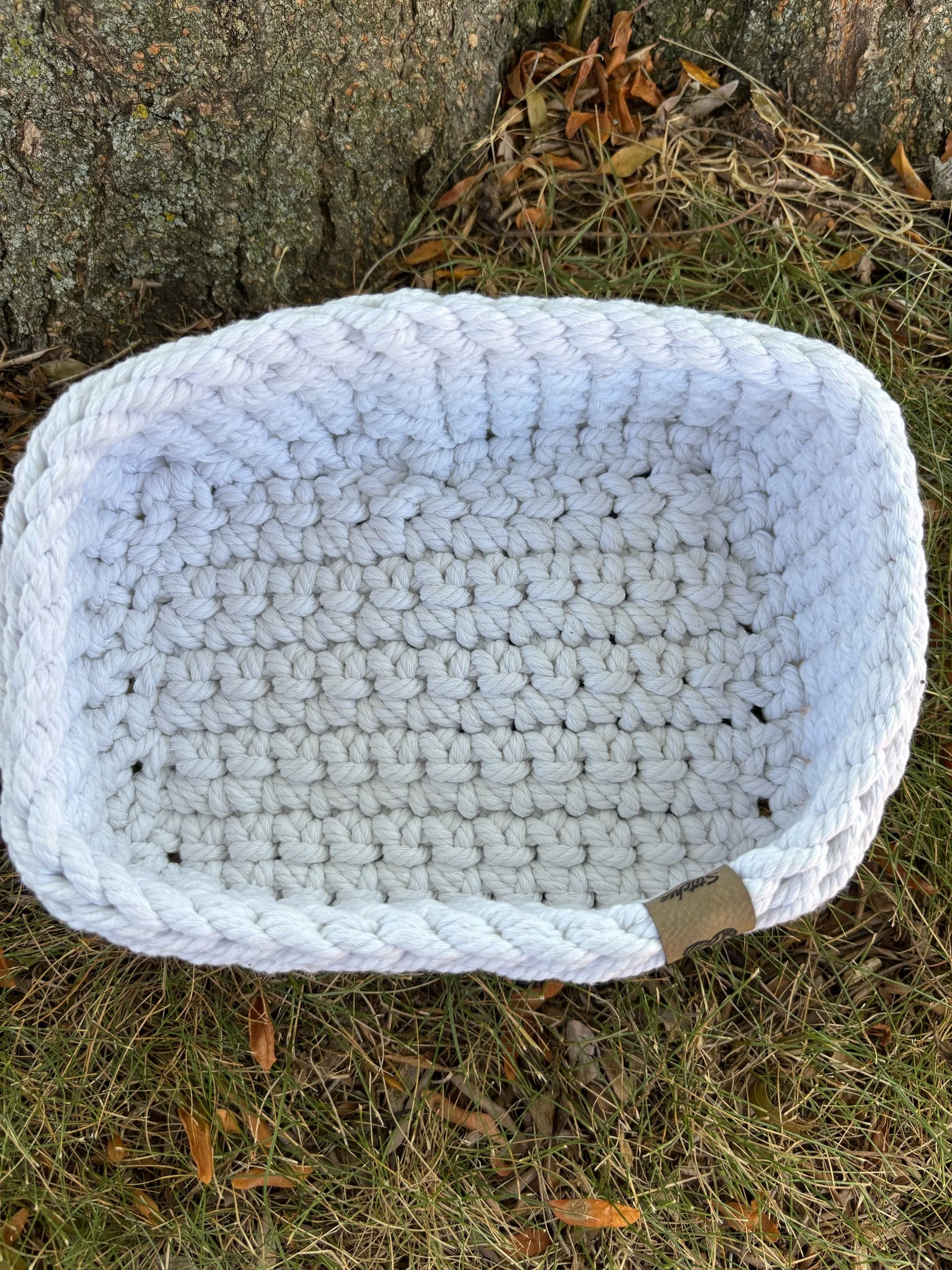 Top-down view of natural macrame basket interior