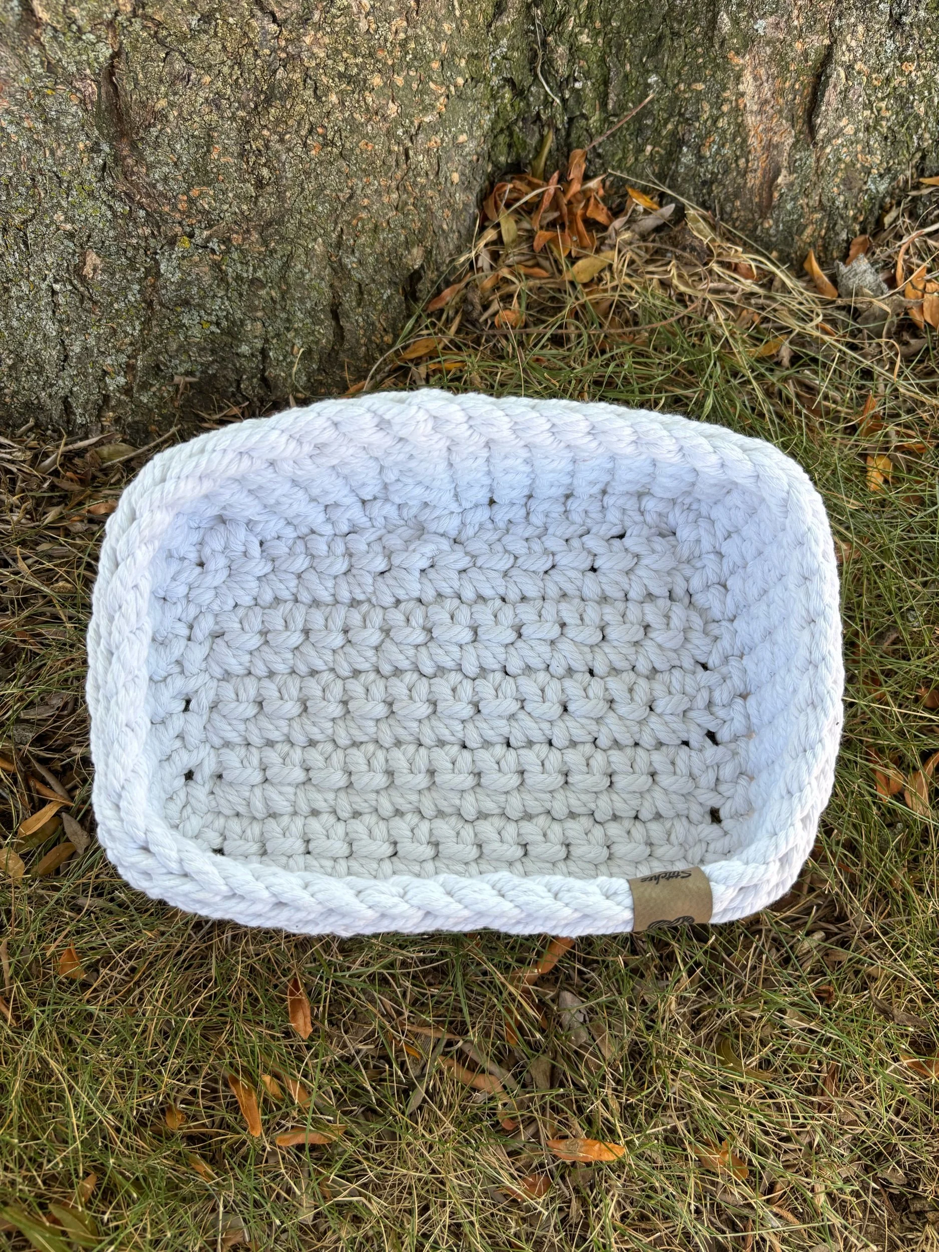 Top-down view of natural macrame basket interior