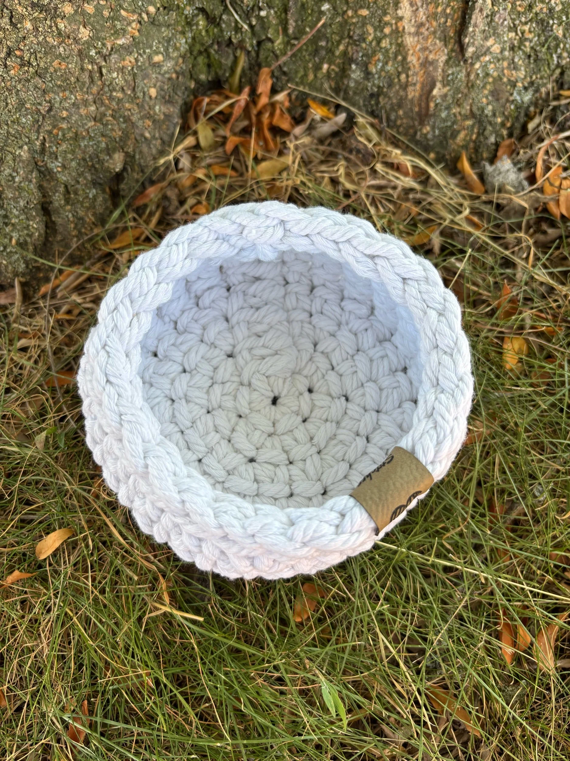 Top-down view of natural macrame basket interior