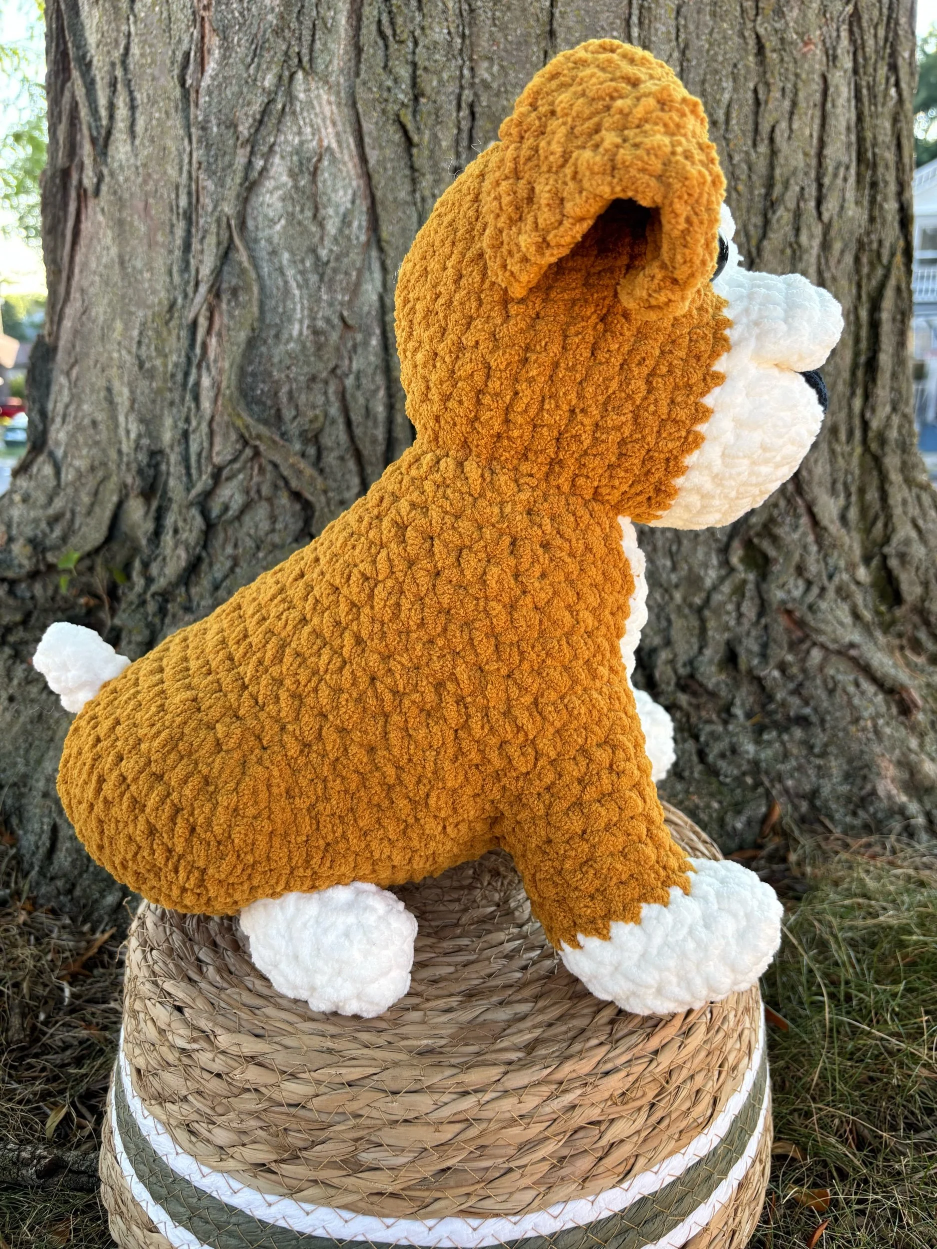 Side view of crochet bulldog puppy showing floppy ear