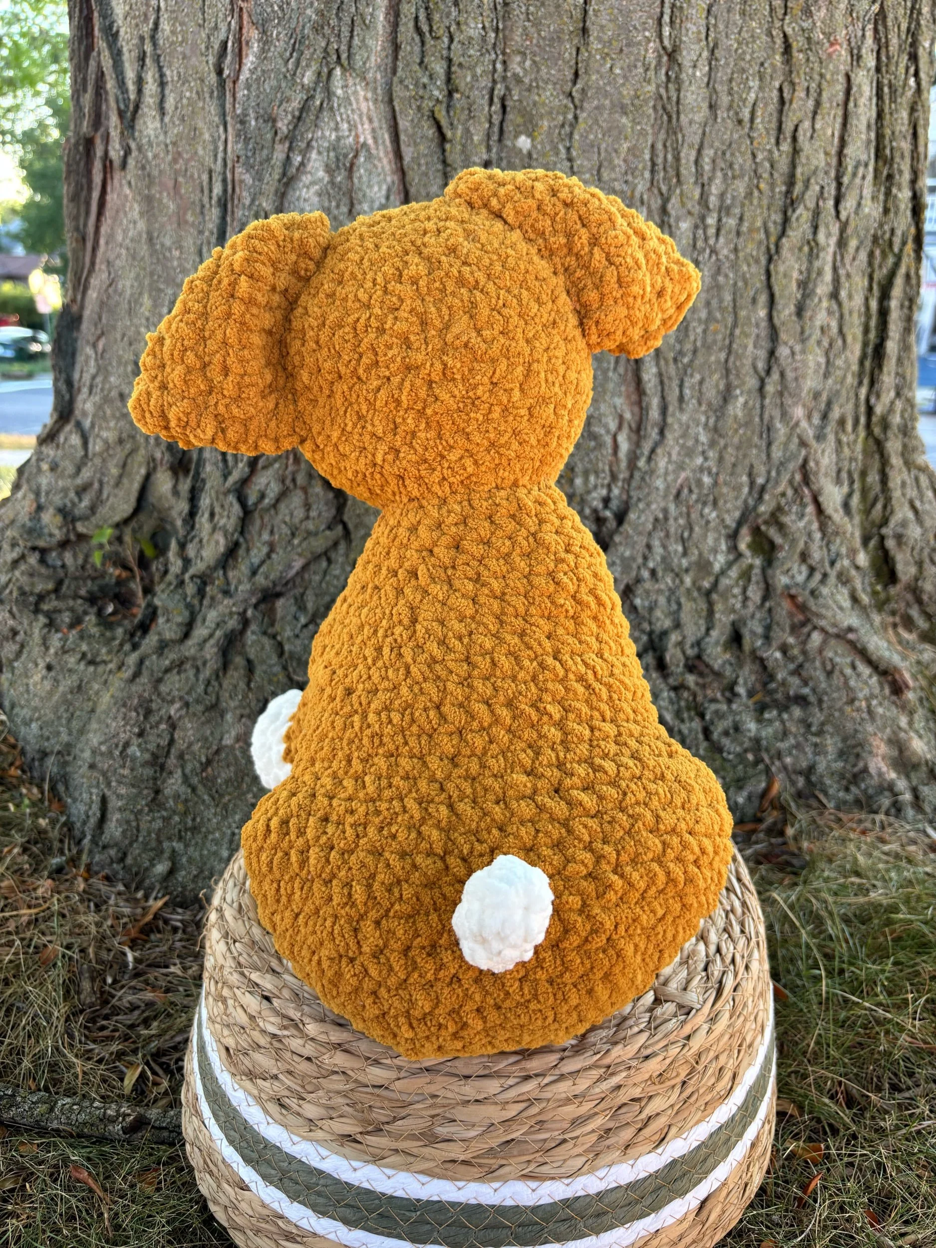 Back of crochet bulldog puppy plushie with tail