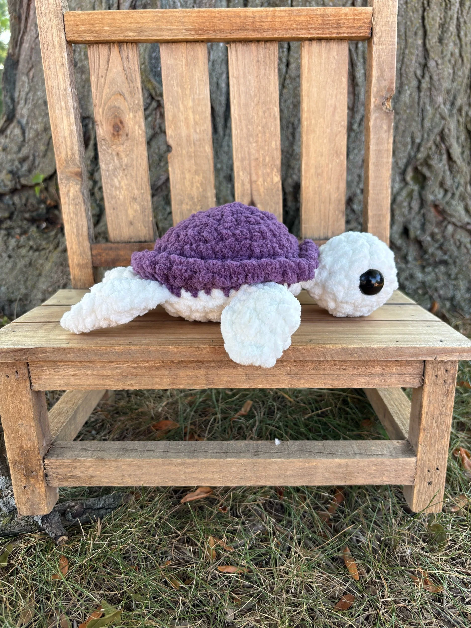 Handmade crochet turtle plushie with purple shell
