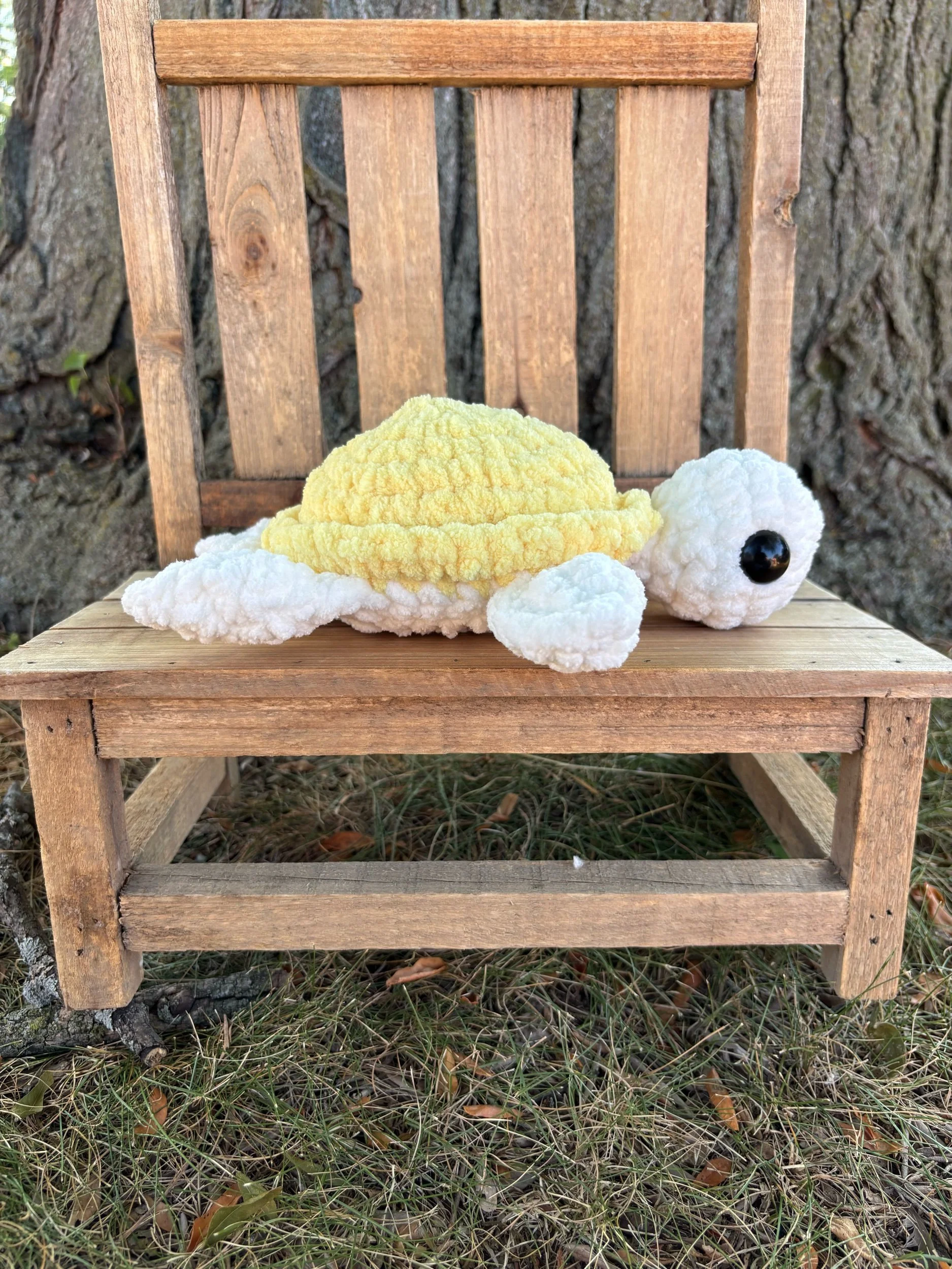 Handmade crochet turtle plushie with yellow shell