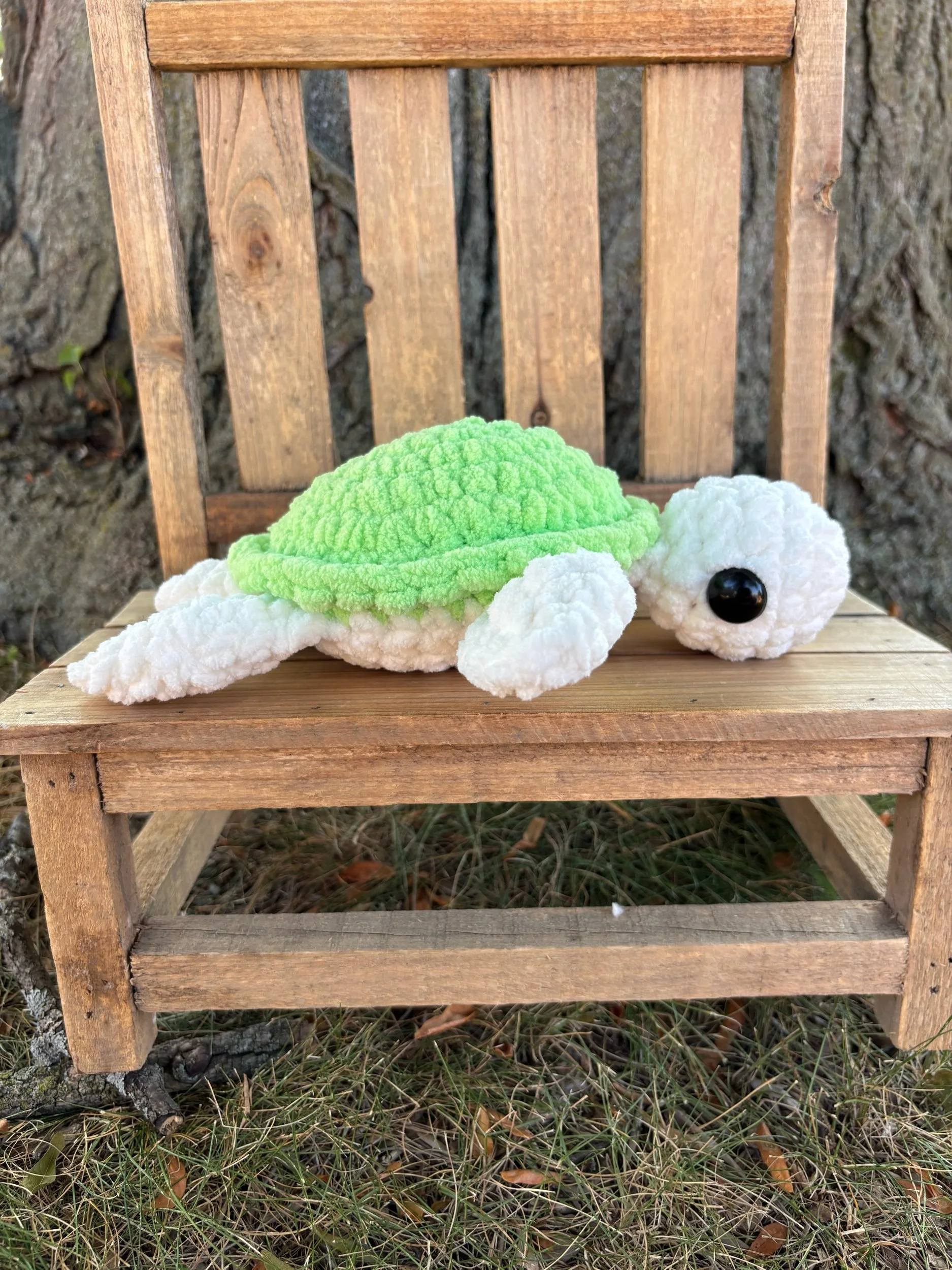 Handmade crochet turtle plushie with green shell