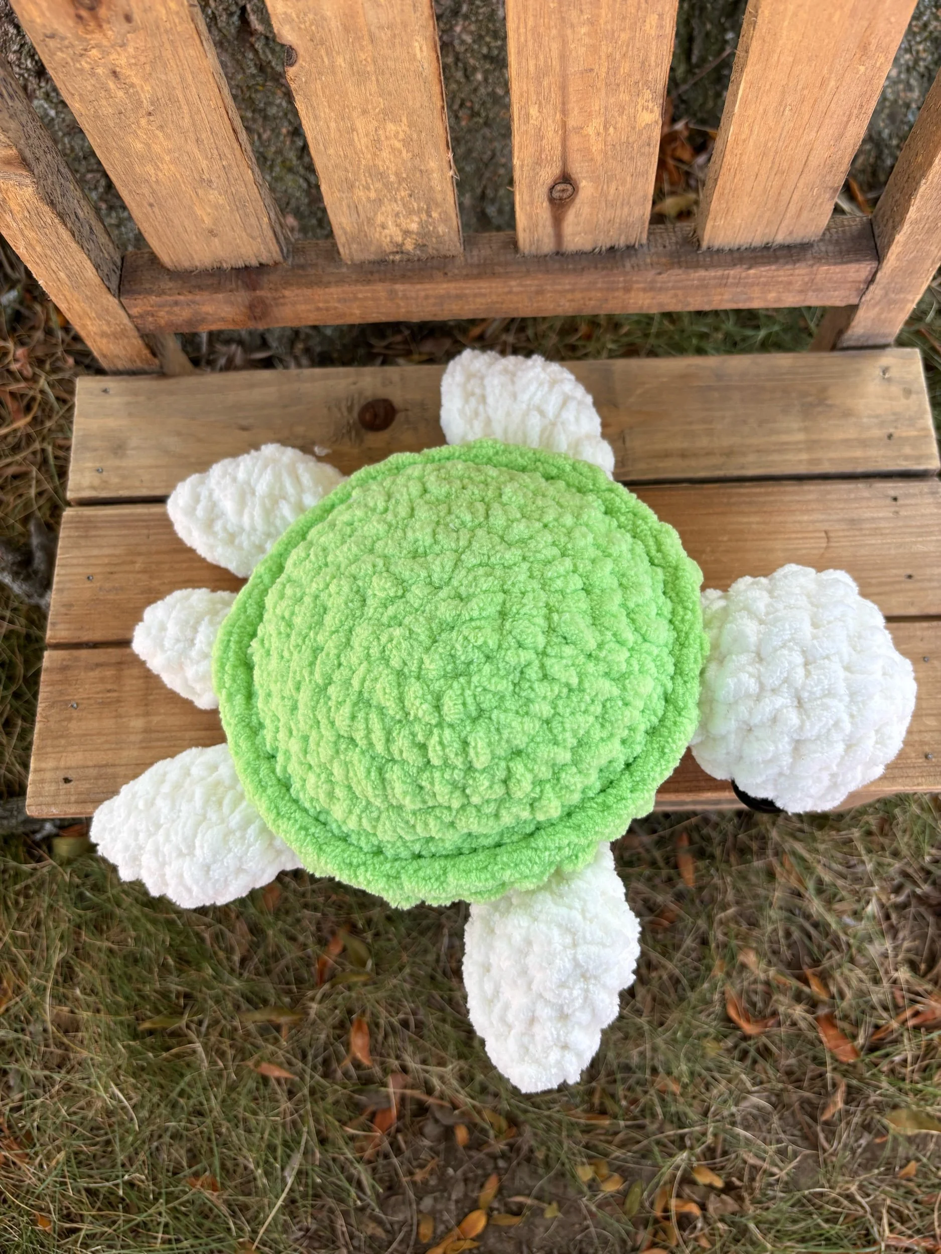Handmade crochet turtle plushie with green shell