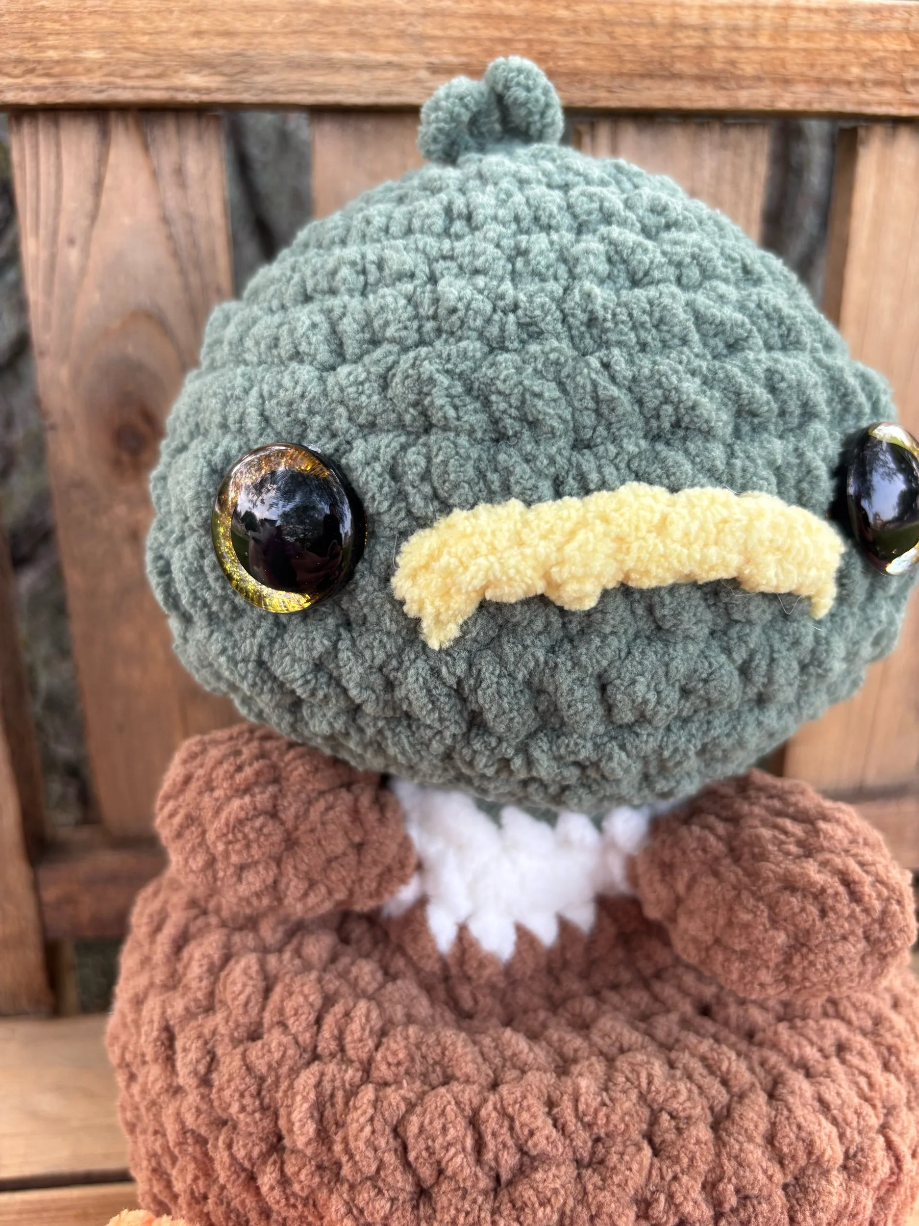 Close up of crochet weighted mallard duck plushie face