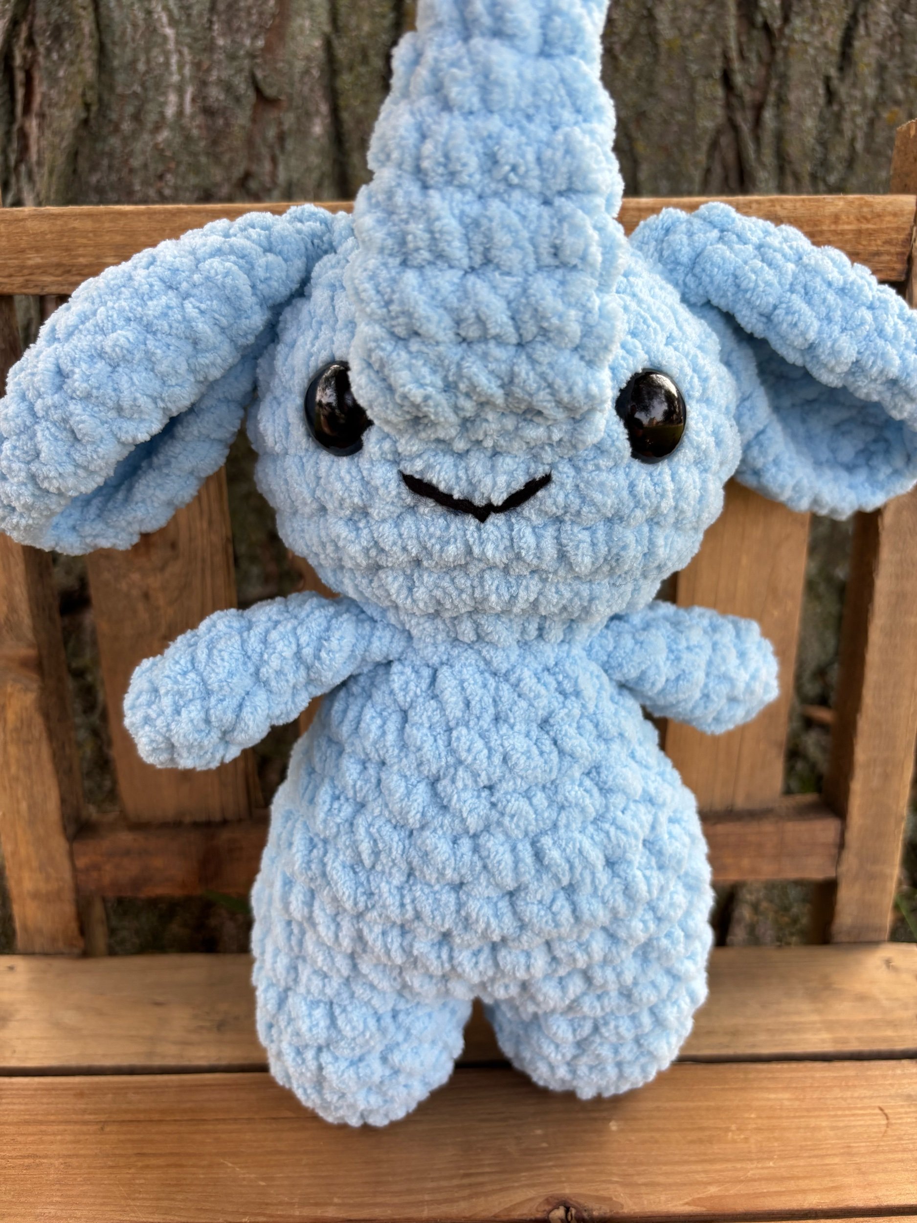 Close up of crochet elephant plushie face