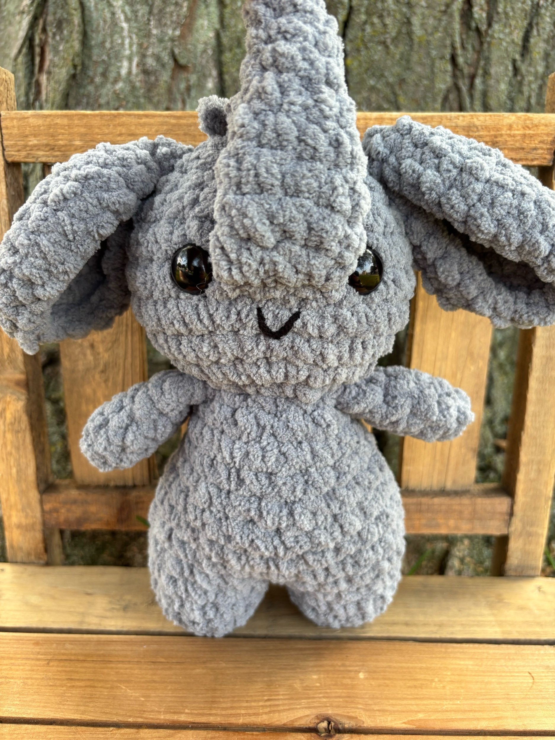 Close up of crochet elephant plushie face