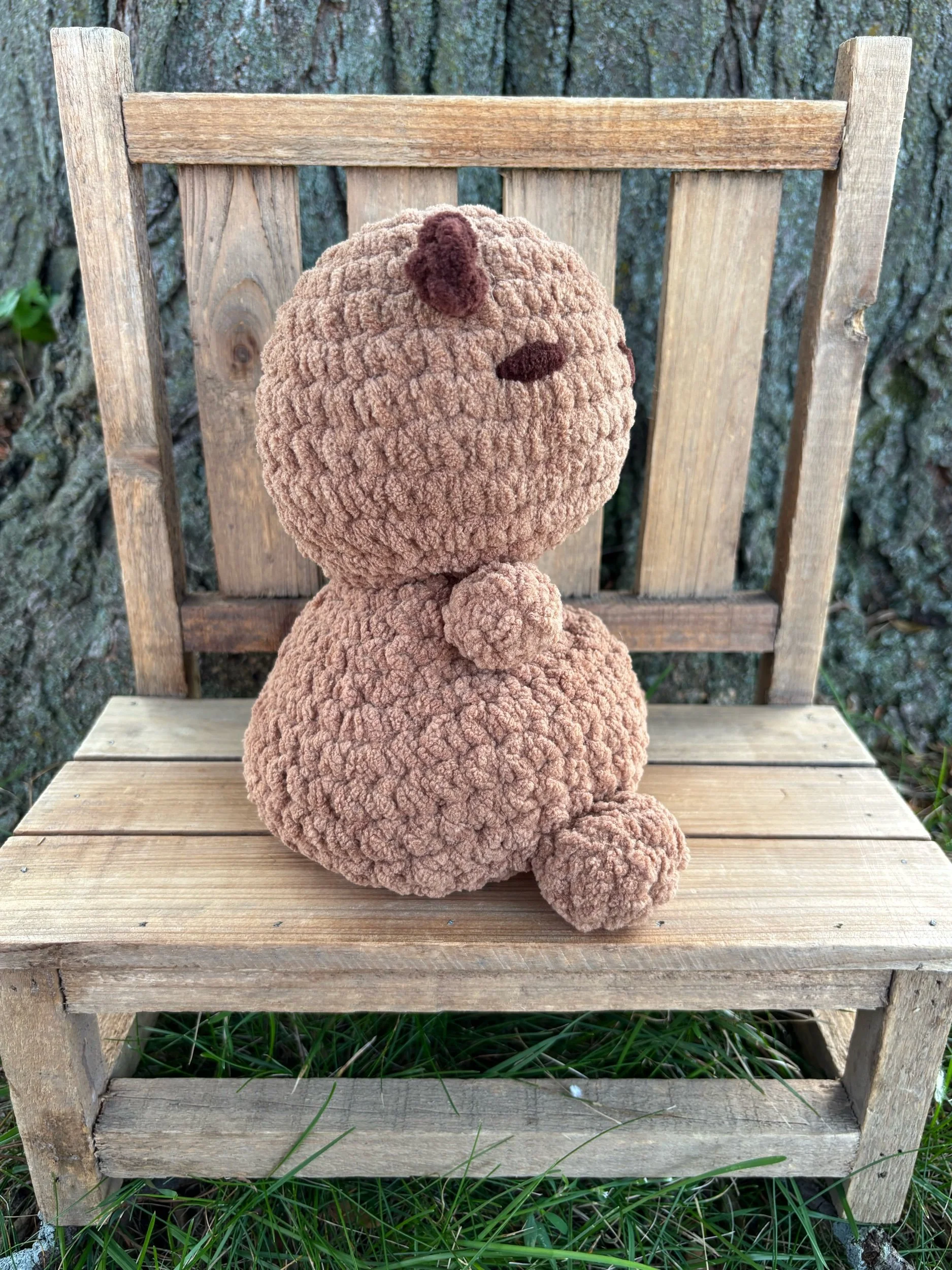 Side view of handmade weighted crochet capybara plushie