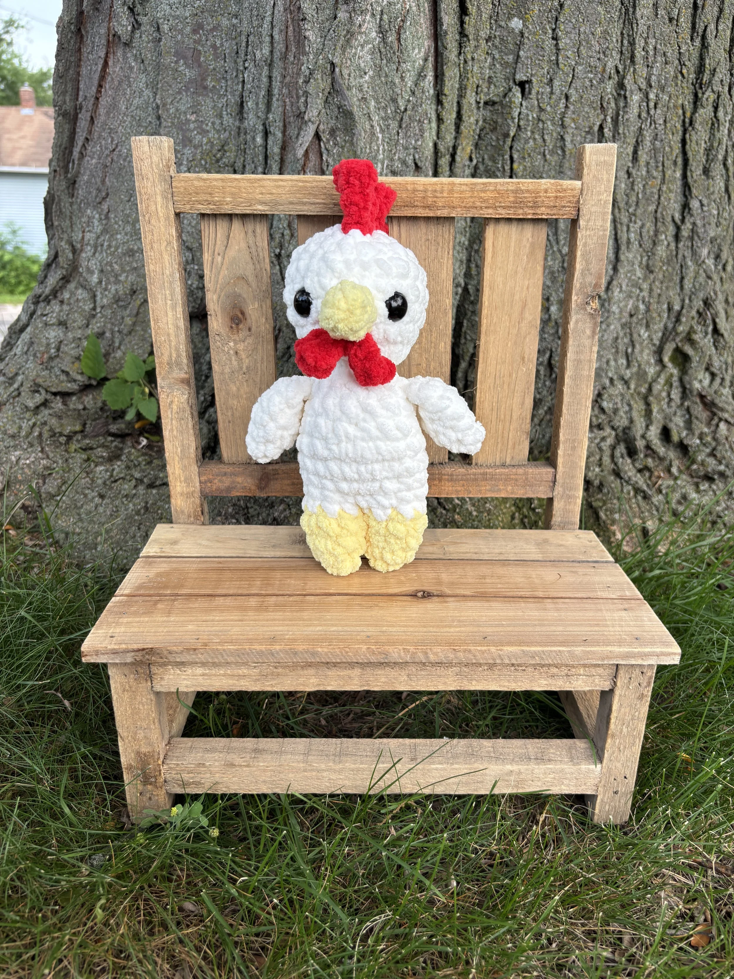 Handmade crochet chicken plushie with red comb