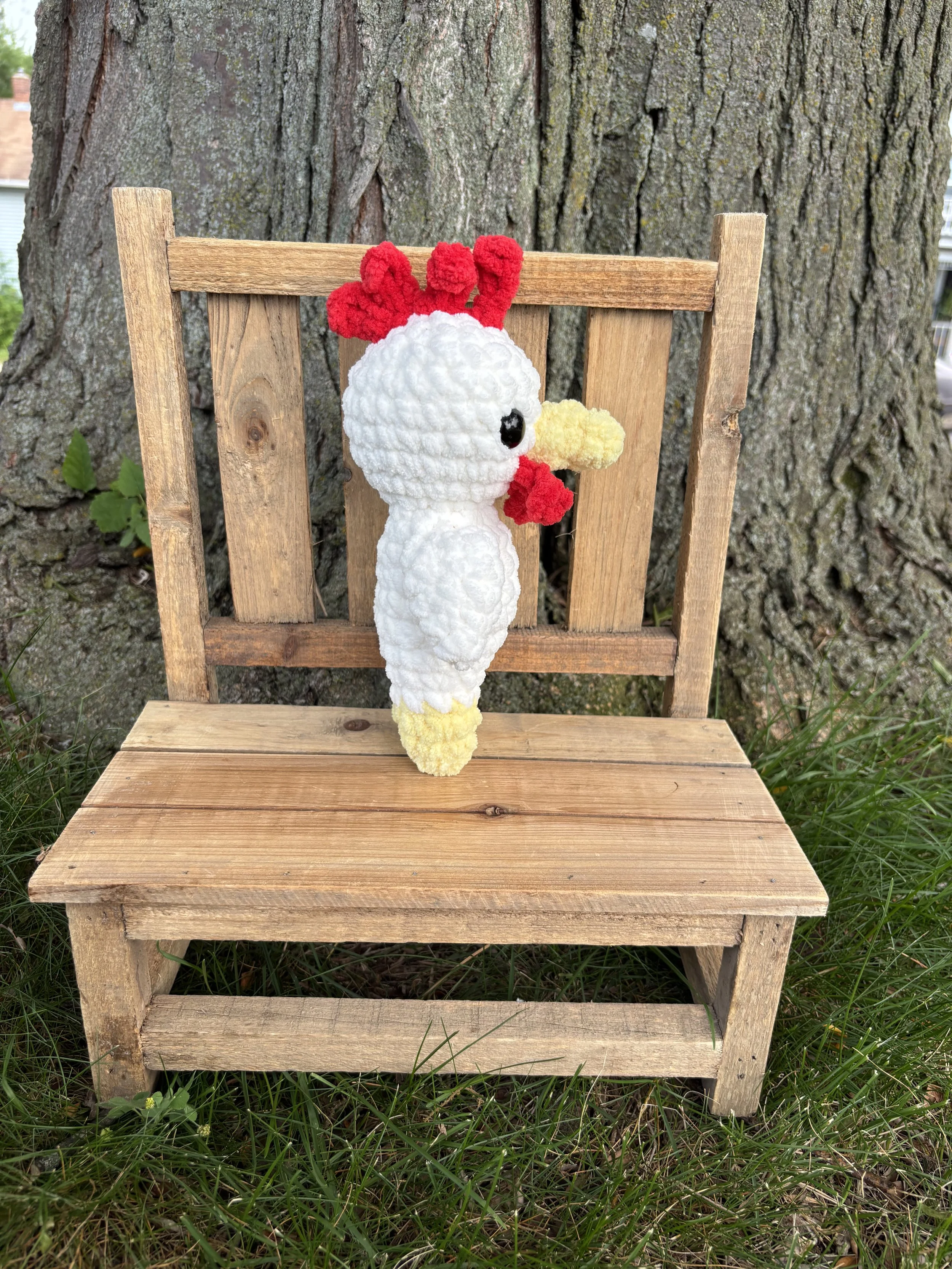 Handmade crochet chicken plushie with red comb
