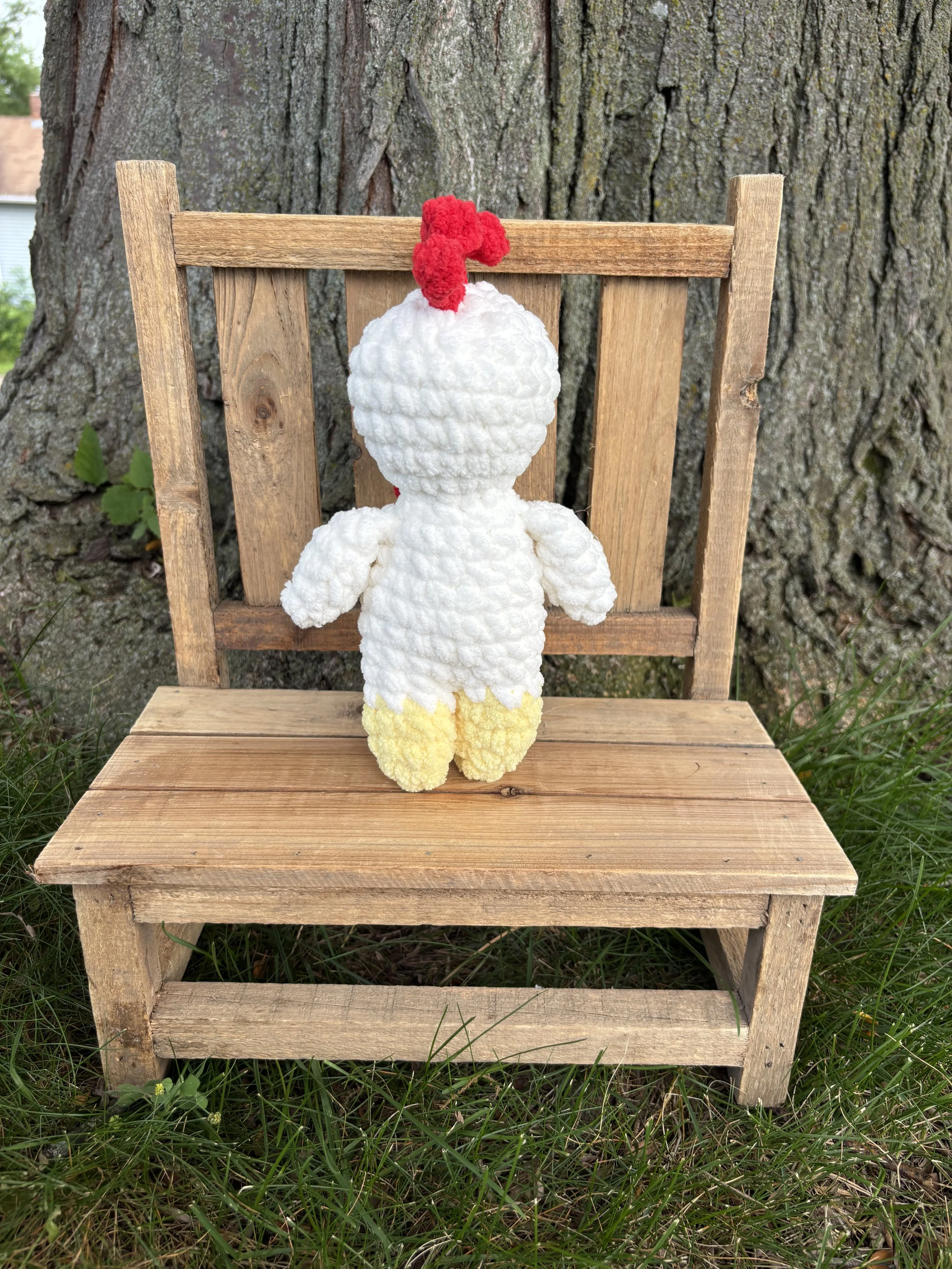 Handmade crochet chicken plushie with red comb