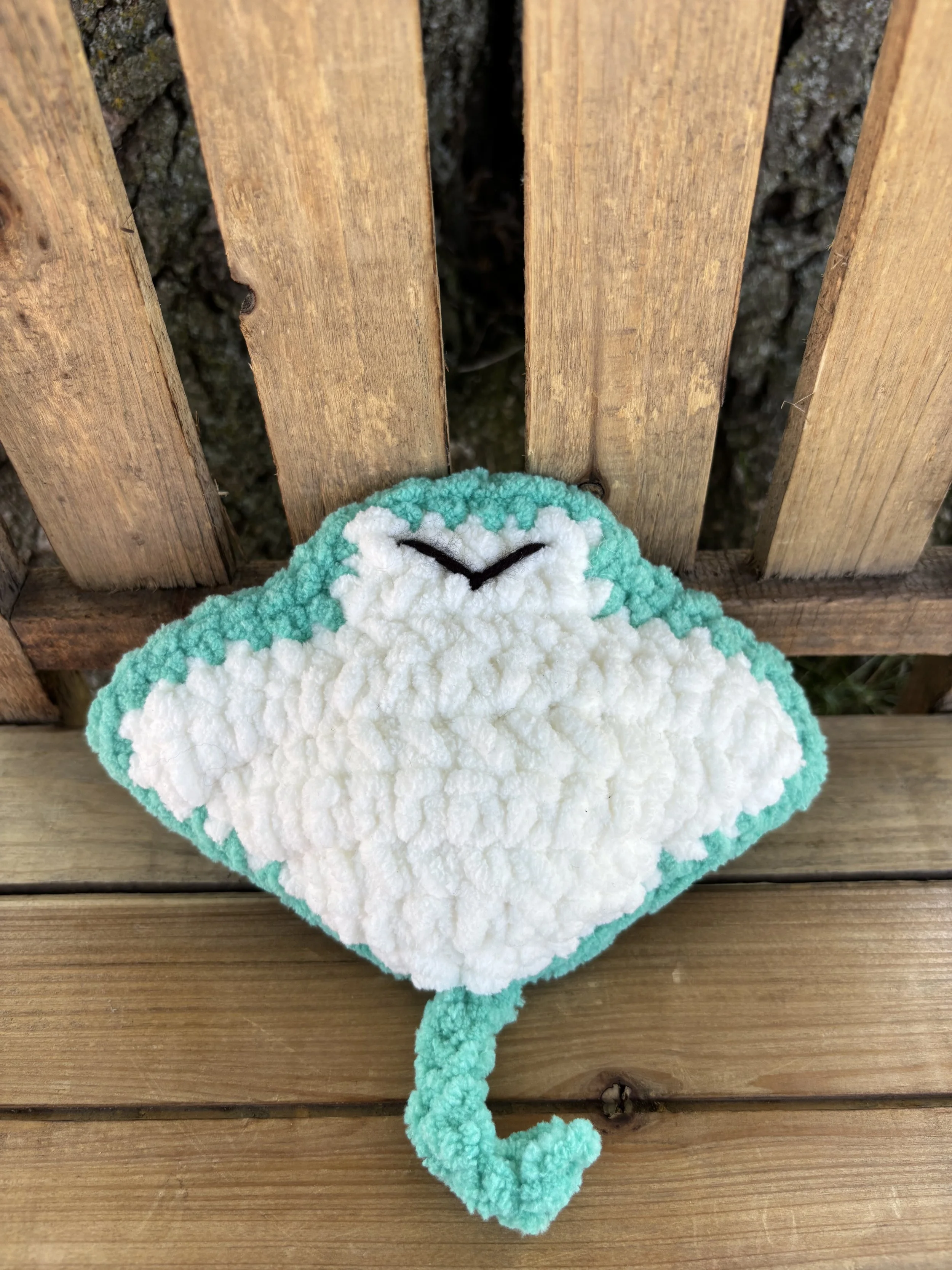 Close up of crochet stingray plushie smile