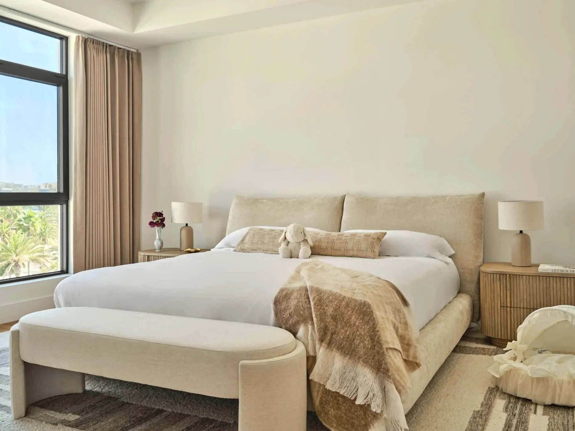 Edra's Stand By Me bed frame paired with a neutral wood fluted nightstand. 