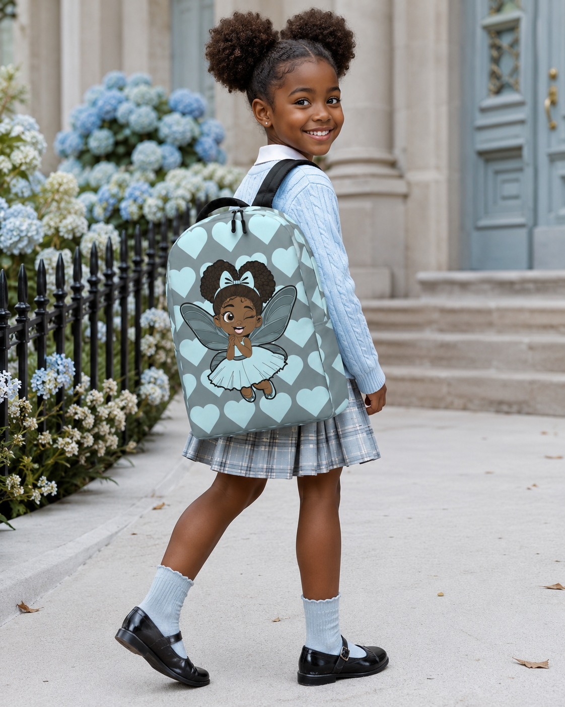 Gleeful Grace Pixie Backpack by Coco Pixies with icy blue hearts, afro puffs, wings, and gray background