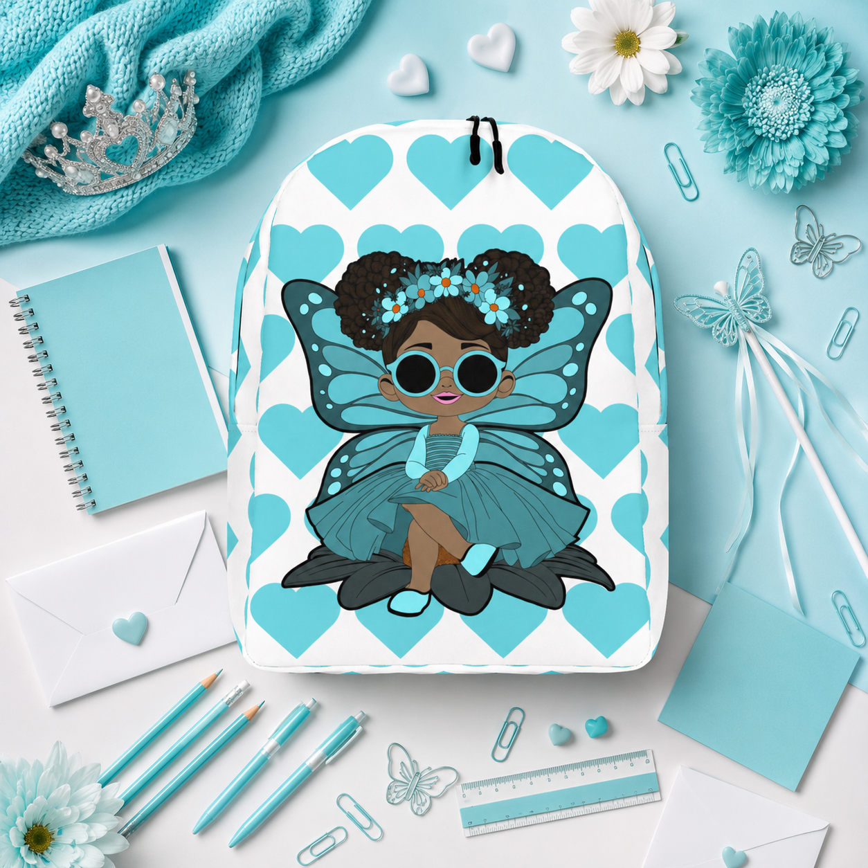 Coco Pixies Sassy Sammy backpack featuring a Black pixie character and aqua signature heart pattern