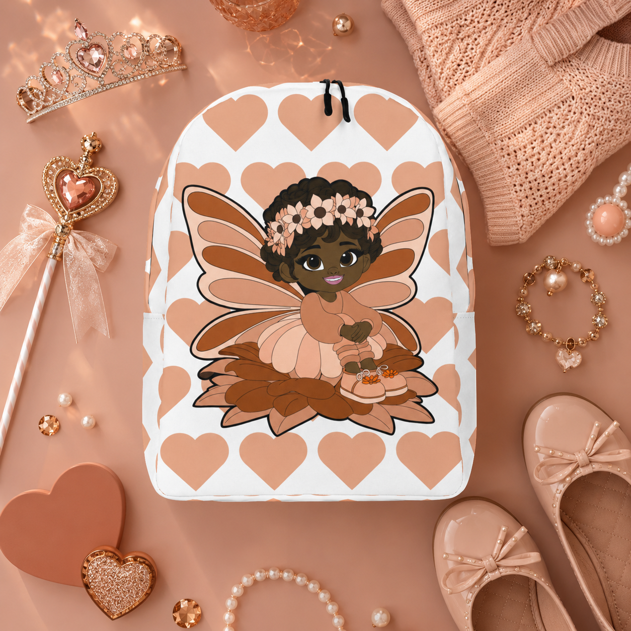 Coco Pixies Signature Heart Pattern Backpack featuring Sweet Sienna, a Black pixie with curls and peach wings