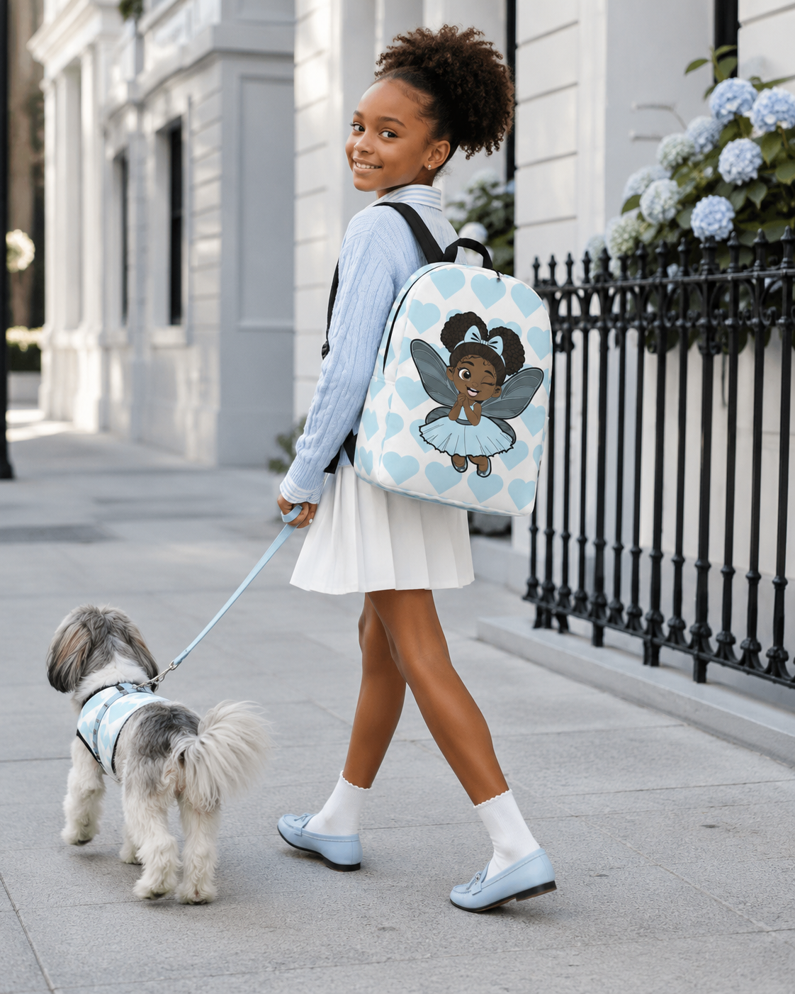 Gleeful Grace Pixie Backpack by Coco Pixies with aqua hearts, afro puffs, wings, and a white background