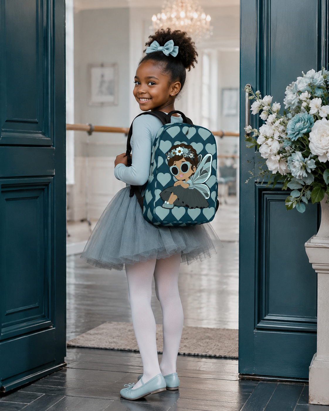 Coco Pixies Pixie Piper Backpack featuring aqua teal hearts, curly hair, sunglasses, and detailed pixie wings
