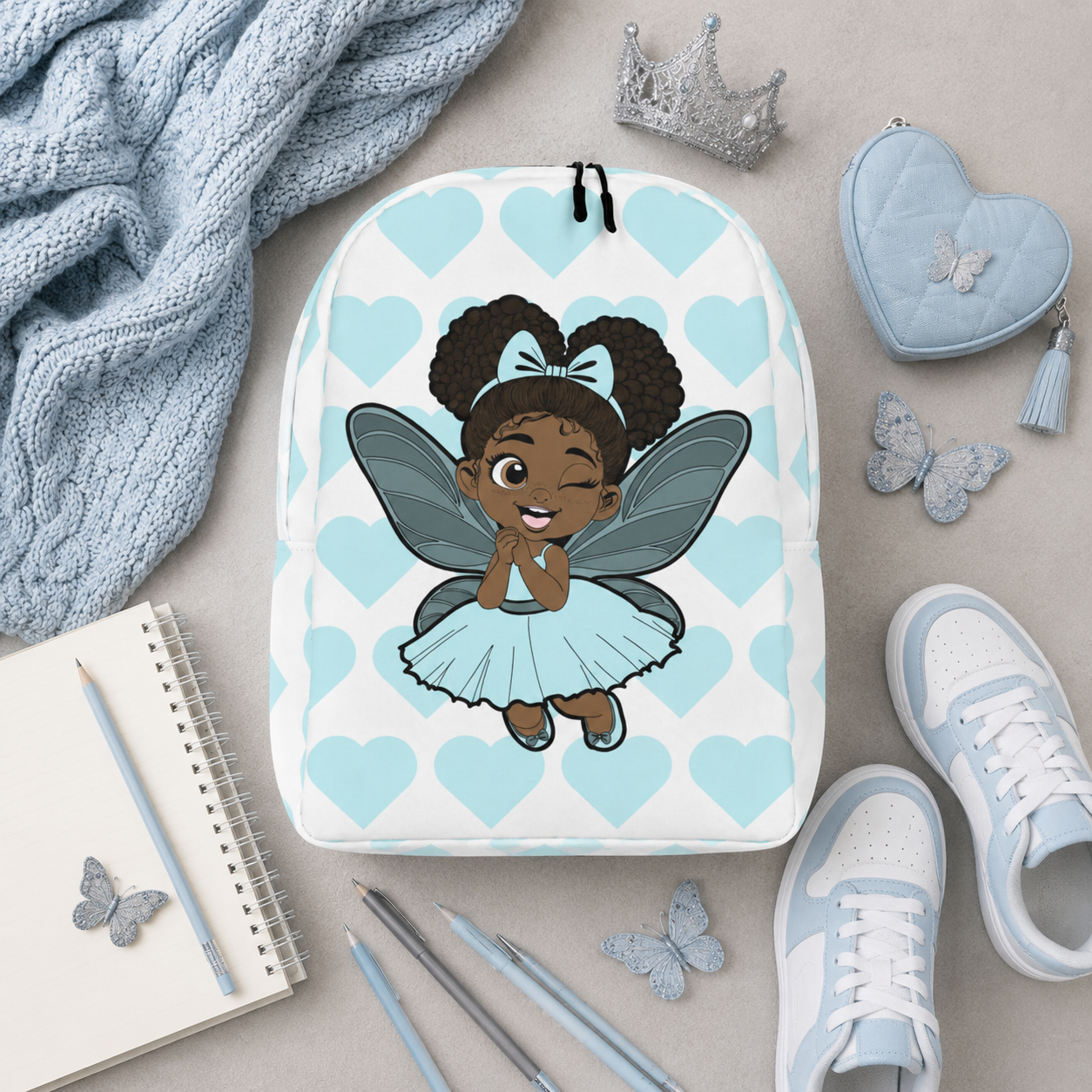 Gleeful Grace Pixie Backpack by Coco Pixies with aqua hearts, afro puffs, wings, and a white background