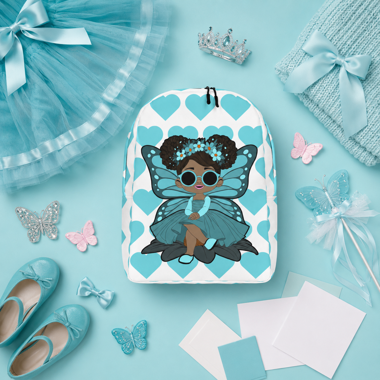 Coco Pixies Sassy Sammy backpack featuring a Black pixie character and aqua signature heart pattern