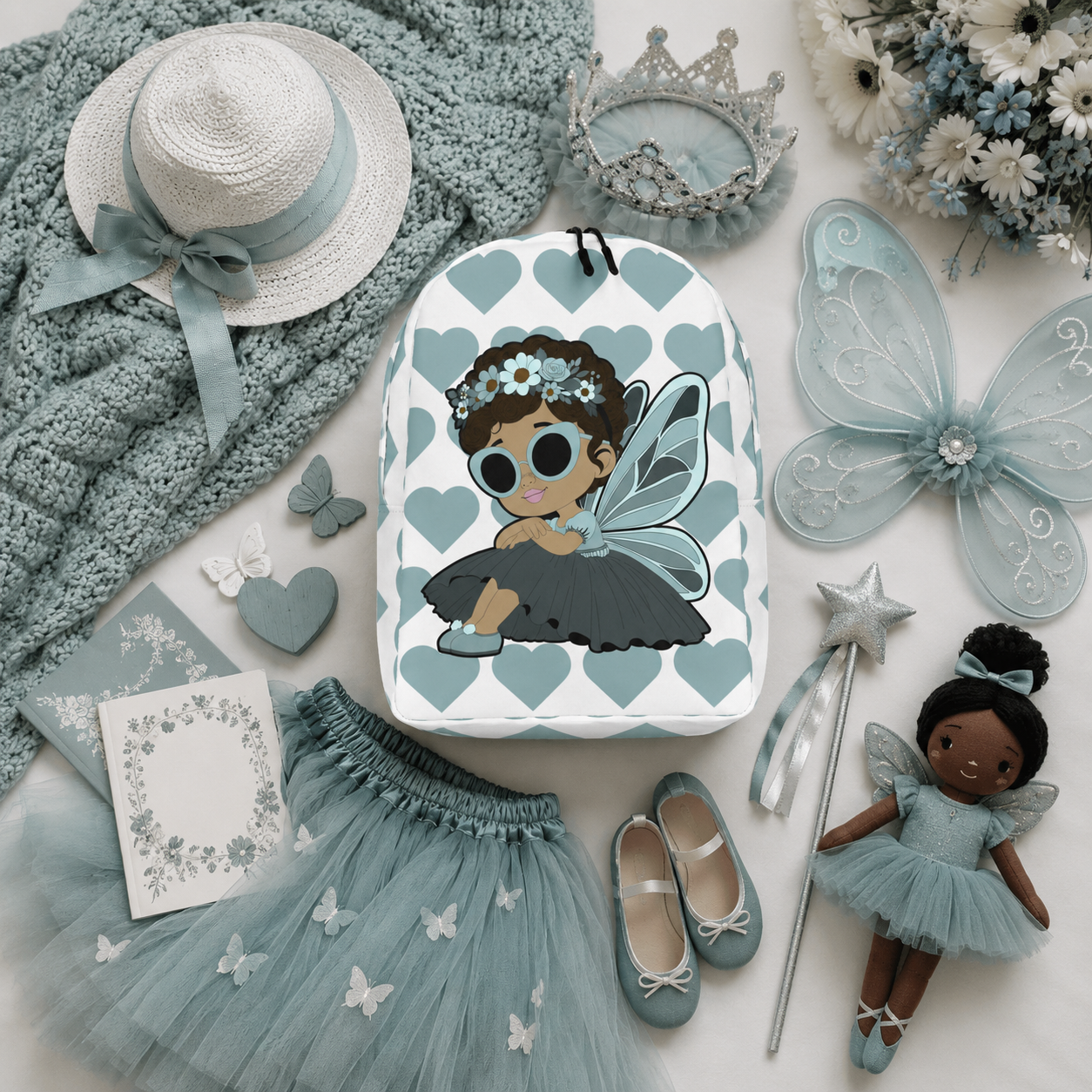 Coco Pixies Pixie Piper Backpack featuring a Black girl pixie, aqua hearts, sunglasses, and floral details