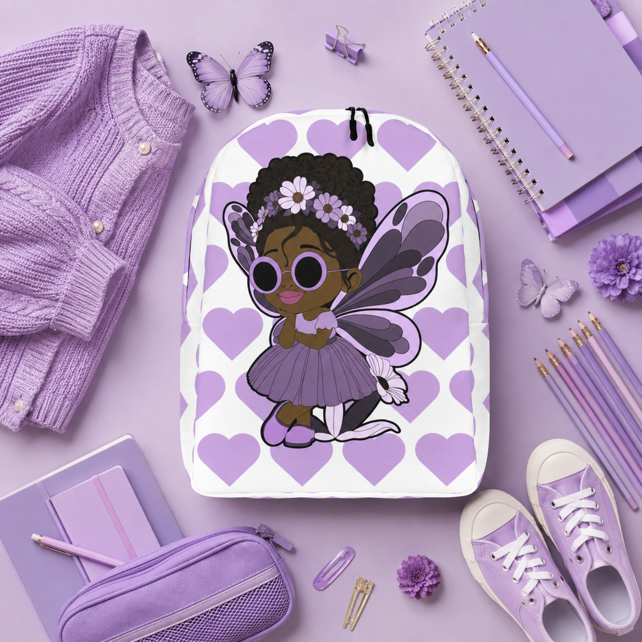 Coco Pixies Marvelous Mia girls backpack featuring a Black pixie with an afro puff, floral crown and purple butterfly wings