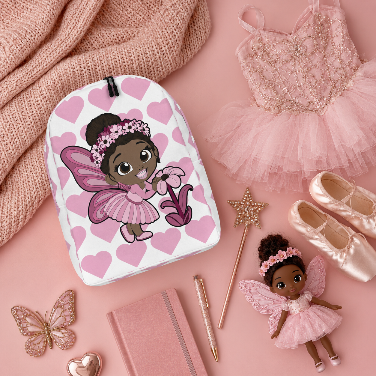 Coco Pixies Tara Twinkle backpack featuring a Black pixie, pink wings, flower crown and heart pattern