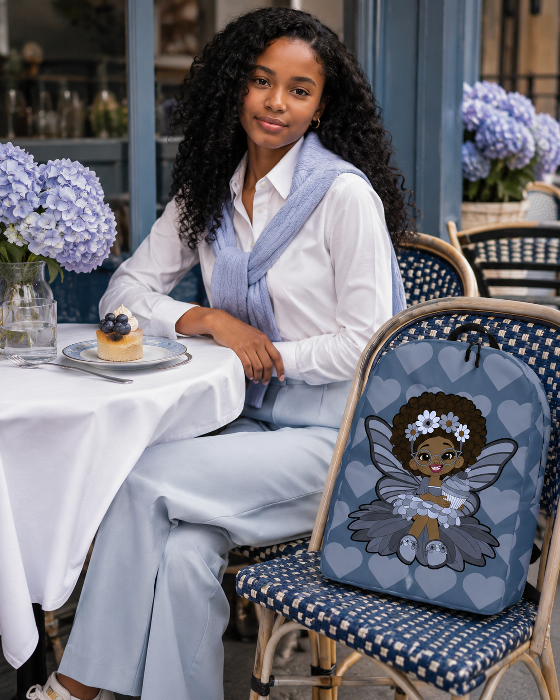 Bubbly Brooke Pixie Backpack by Coco Pixies in cool blue with Black girl pixie and signature heart pattern