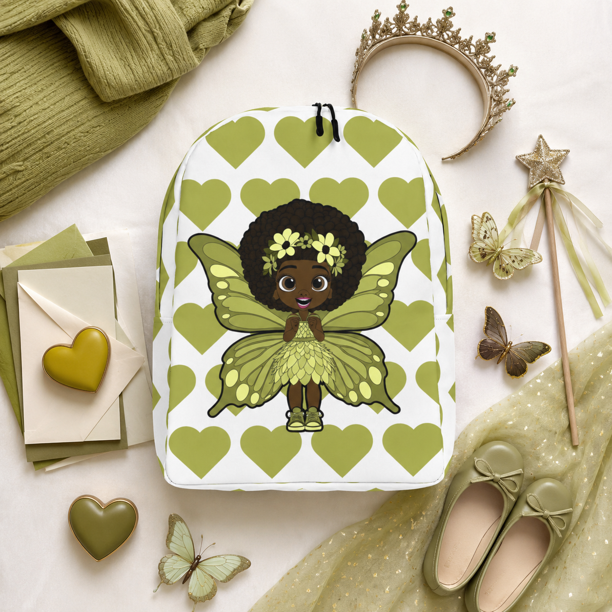 Cheerful Charlotte Pixie backpack featuring a Black girl pixie with green wings on the Coco Pixies signature heart pattern.