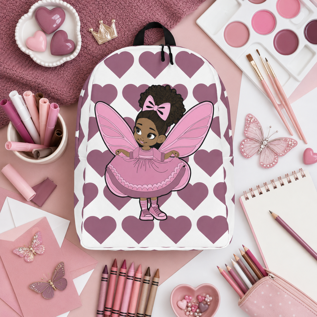 Darling Daphne Pixie Backpack by Coco Pixies with a pink pixie, curly afro puff and mauve heart pattern.