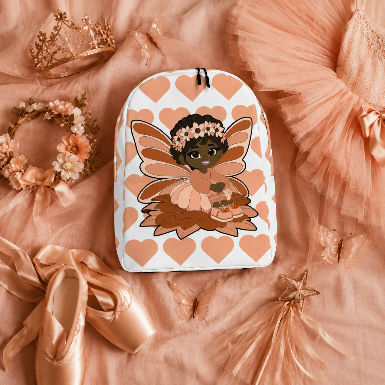 Coco Pixies Signature Heart Pattern Backpack featuring Sweet Sienna, a Black pixie with curls and peach wings