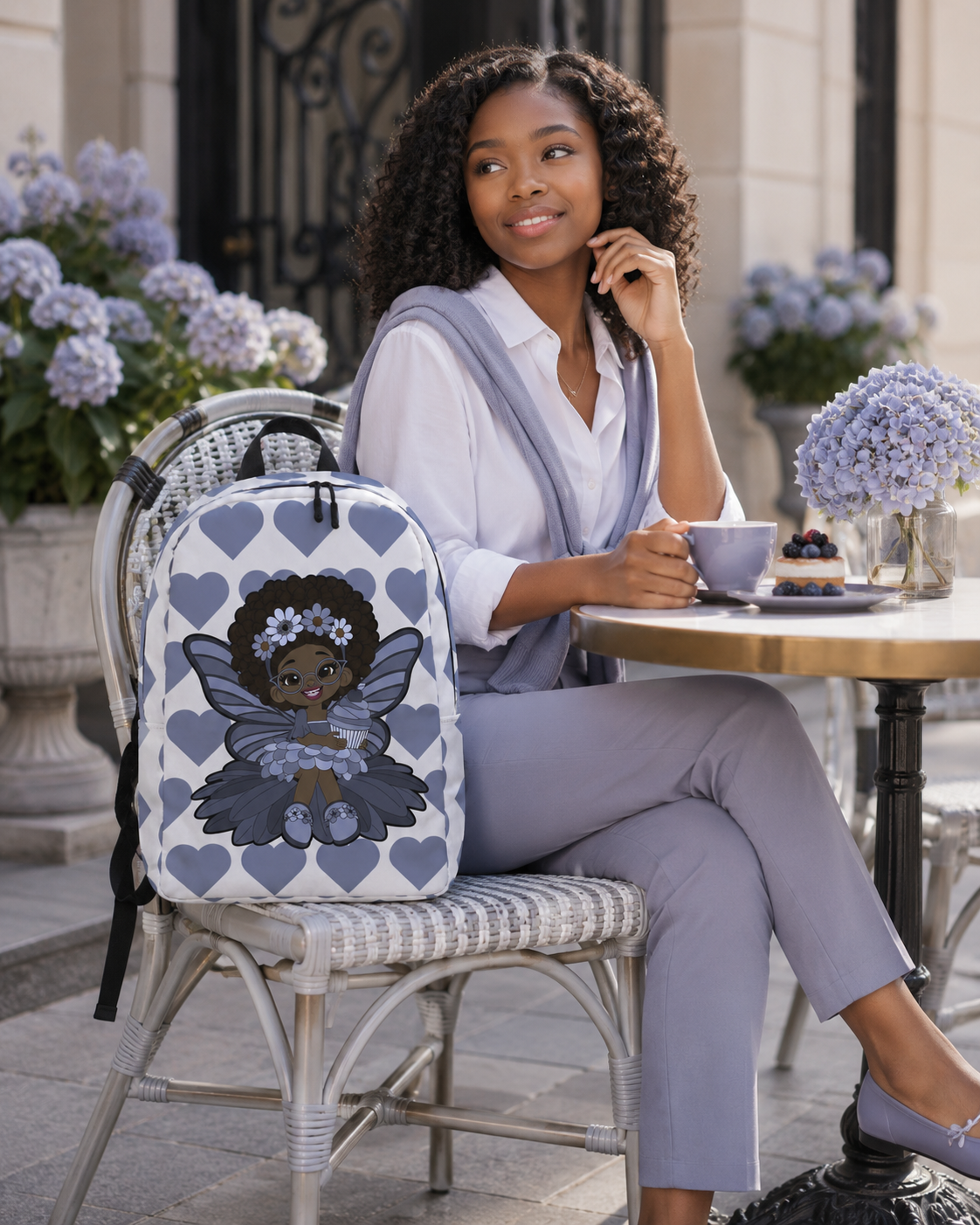 Bubbly Brooke Pixie Backpack by Coco Pixies with a Black girl pixie, cupcake and slate-blue signature heart pattern