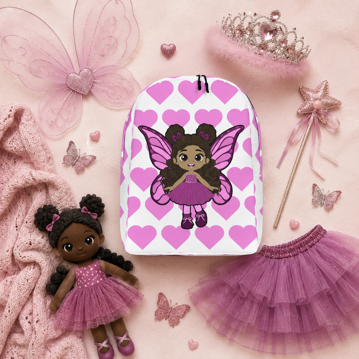 Coco Pixies Fiona Flutter character backpack featuring curly puff buns, pink wings, and heart print