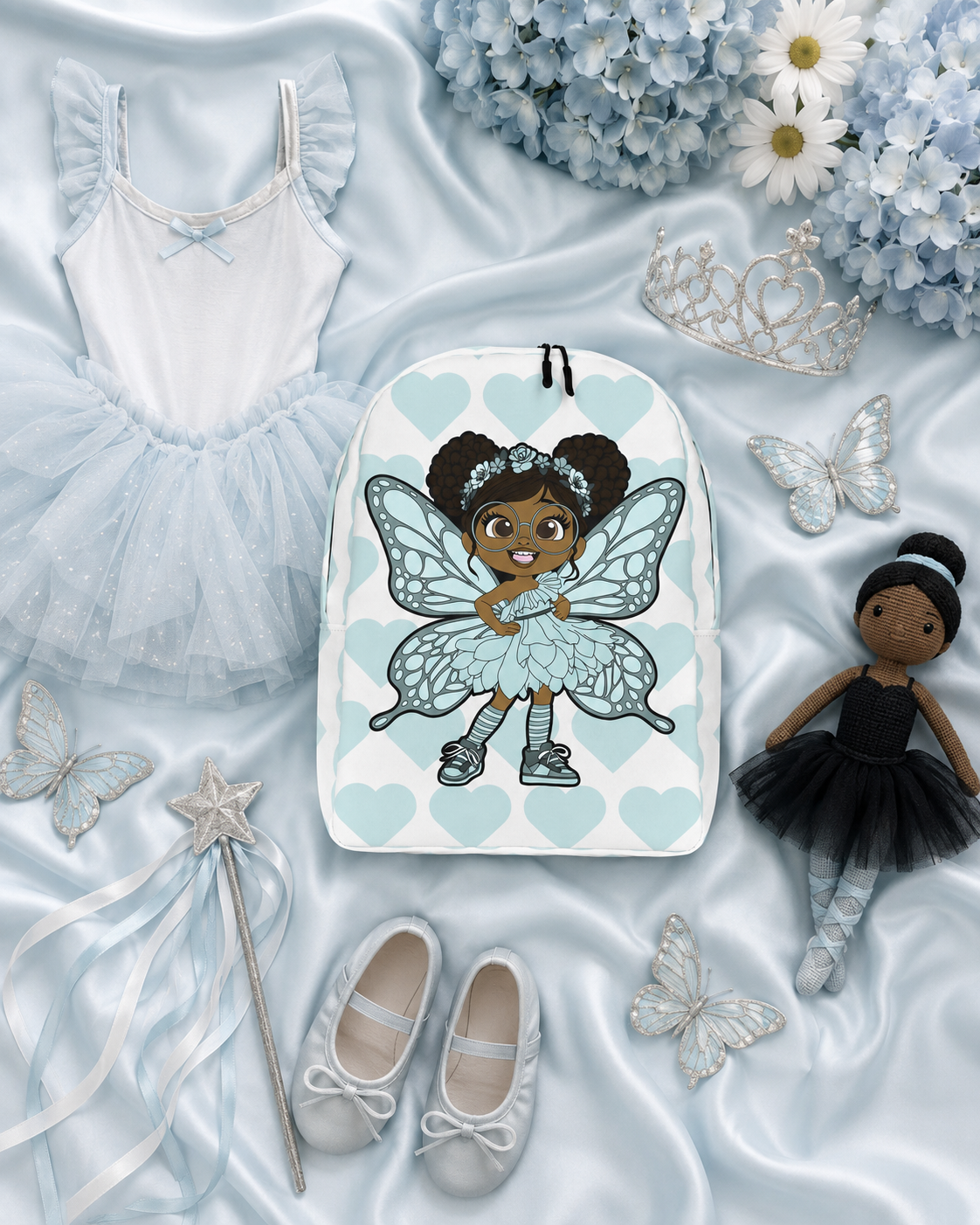 Coco Pixies JoJo Jollypuff backpack featuring afro puffs, glasses, aqua wings, and heart-patterned design