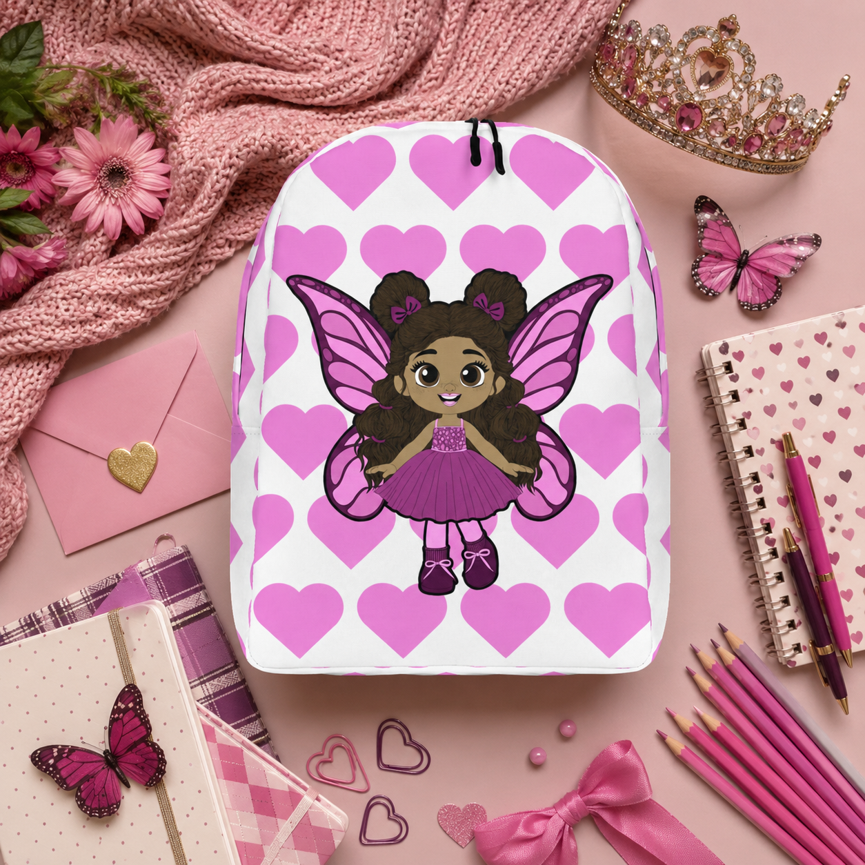Coco Pixies Fiona Flutter character backpack featuring curly puff buns, pink wings, and heart print