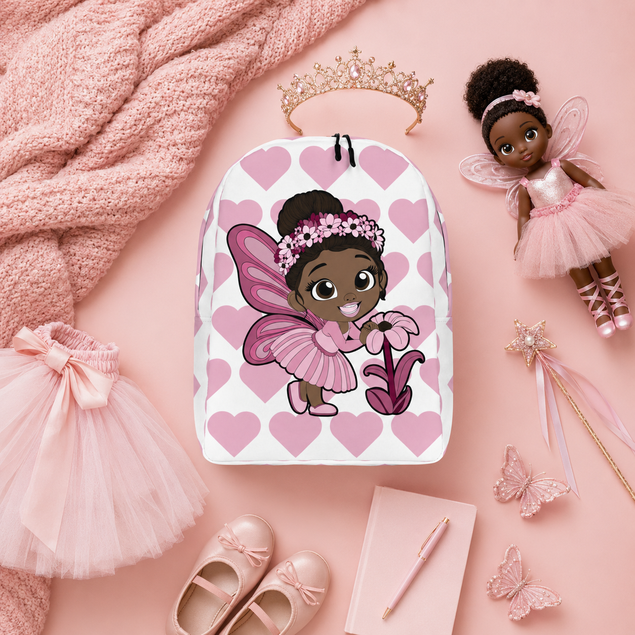 Coco Pixies Tara Twinkle backpack featuring a Black pixie, pink wings, flower crown and heart pattern
