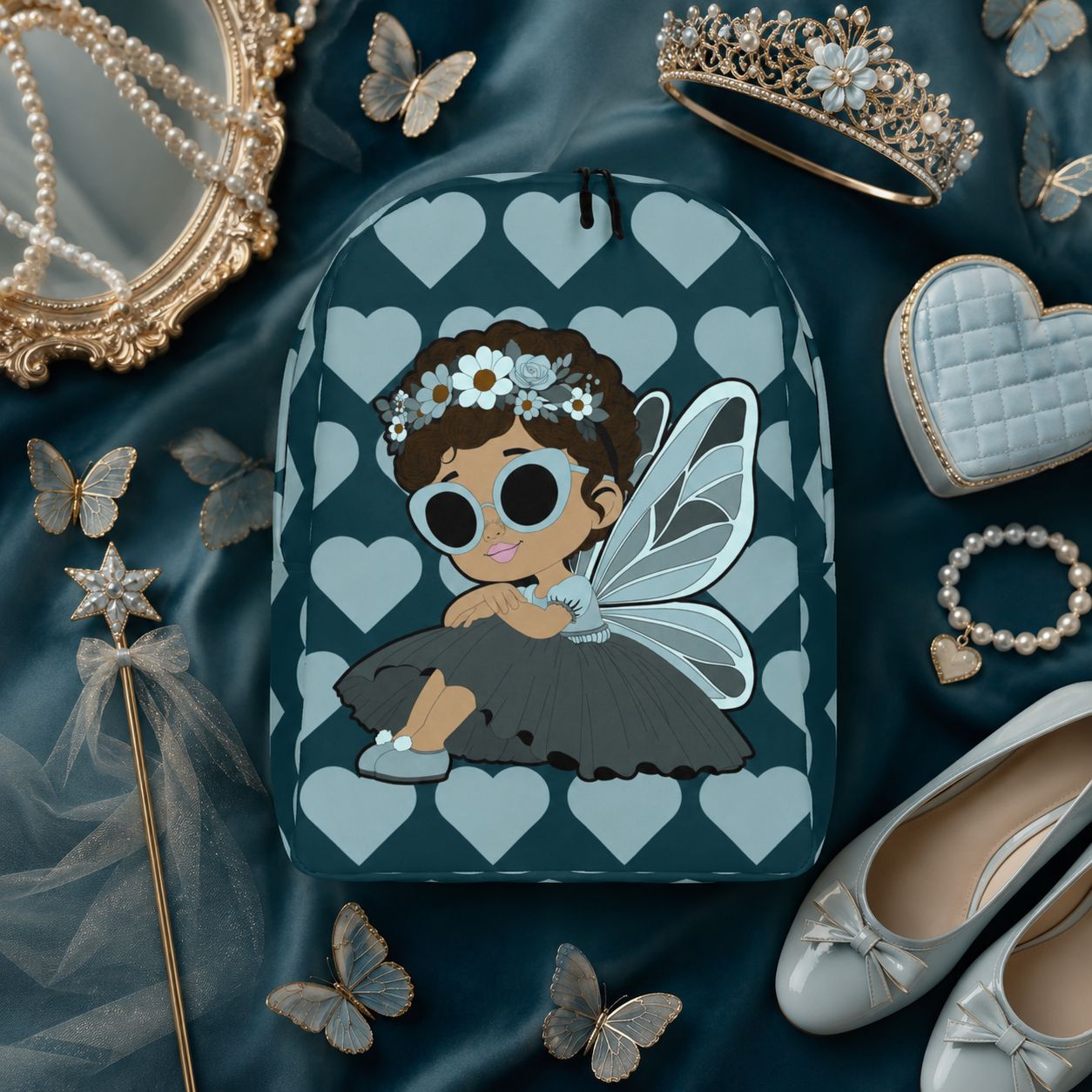 Coco Pixies Pixie Piper Backpack featuring aqua teal hearts, curly hair, sunglasses, and detailed pixie wings