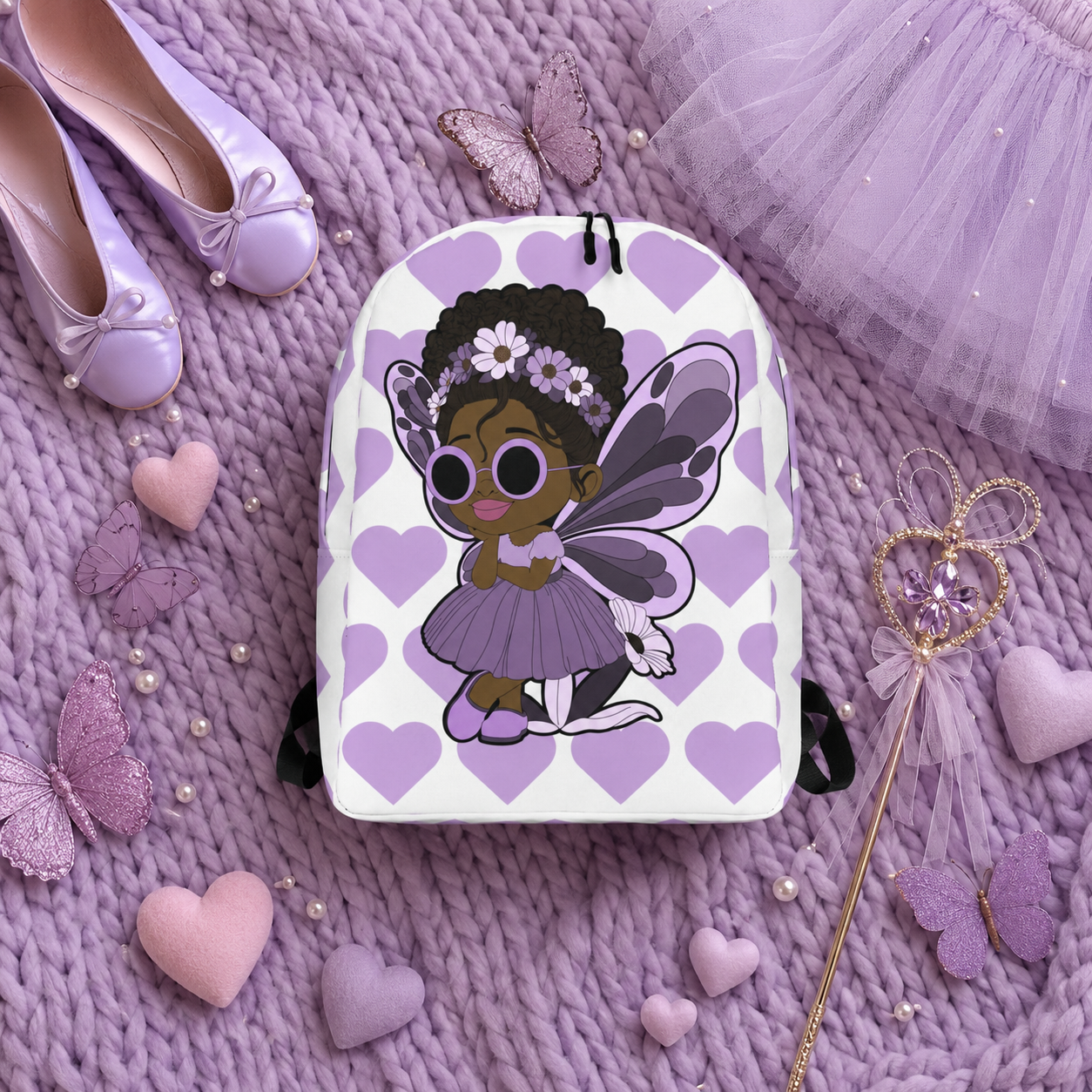 Coco Pixies Marvelous Mia girls backpack featuring a Black pixie with an afro puff, floral crown and purple butterfly wings
