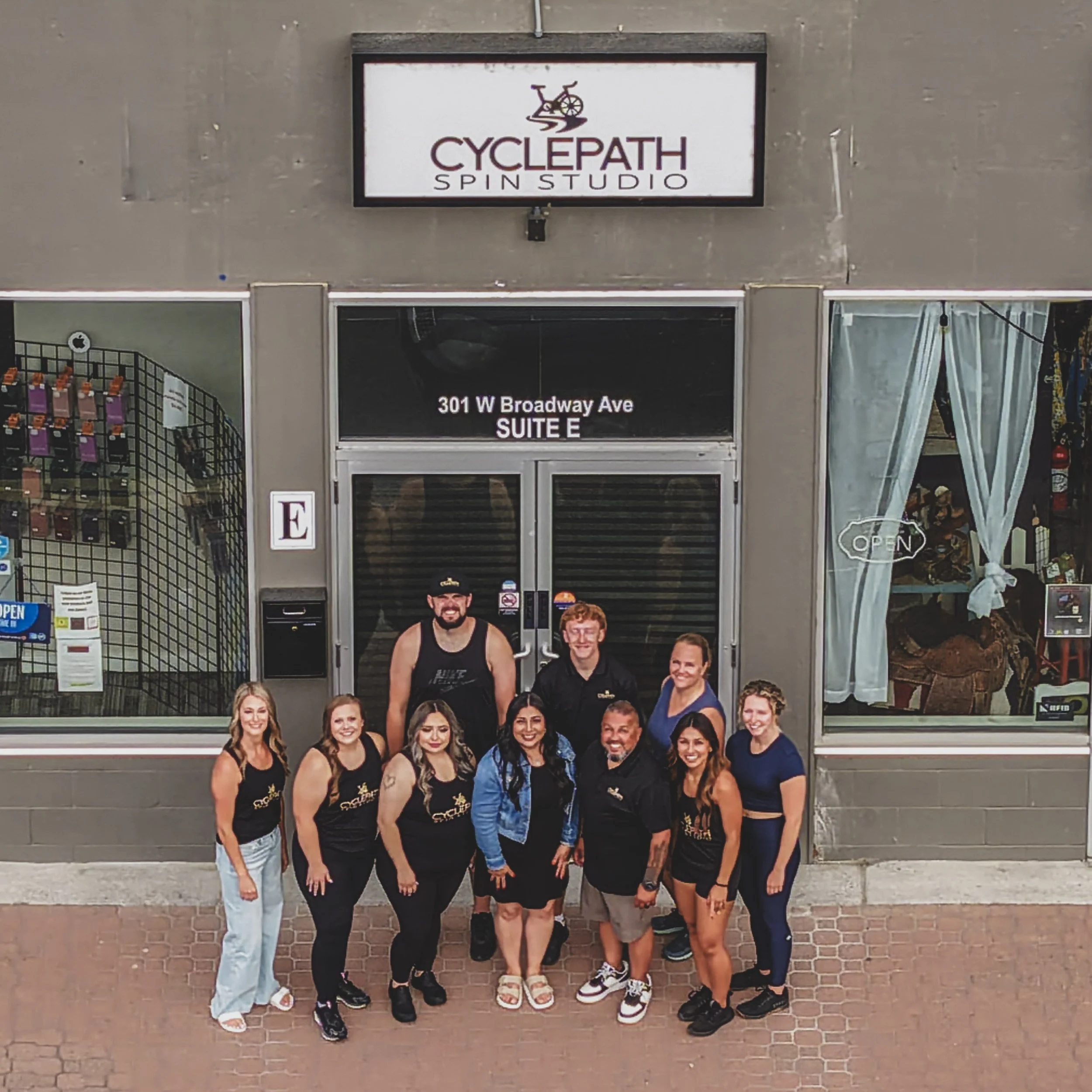 Group photo of the Cyclepath staff outside the studio