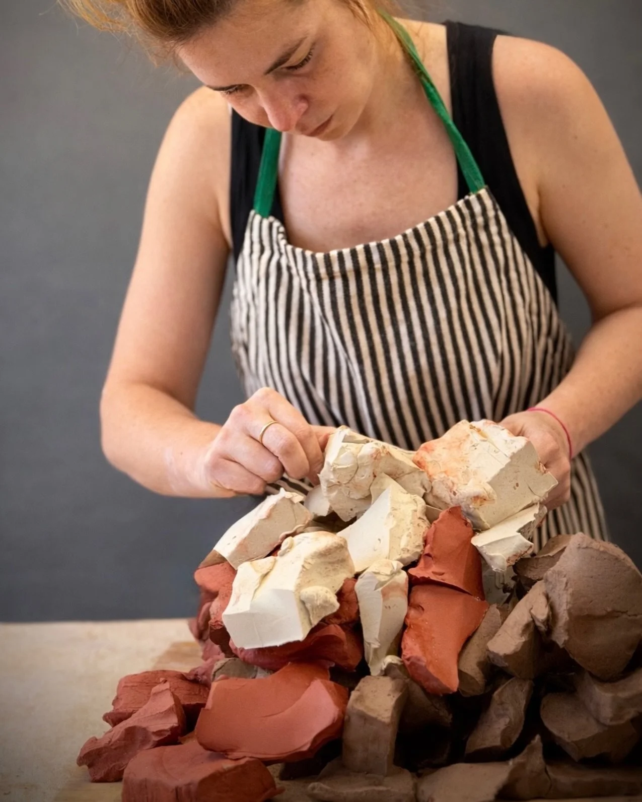 Thinking through clay the way architecture thinks through walls: pressure, repetition, erosion.