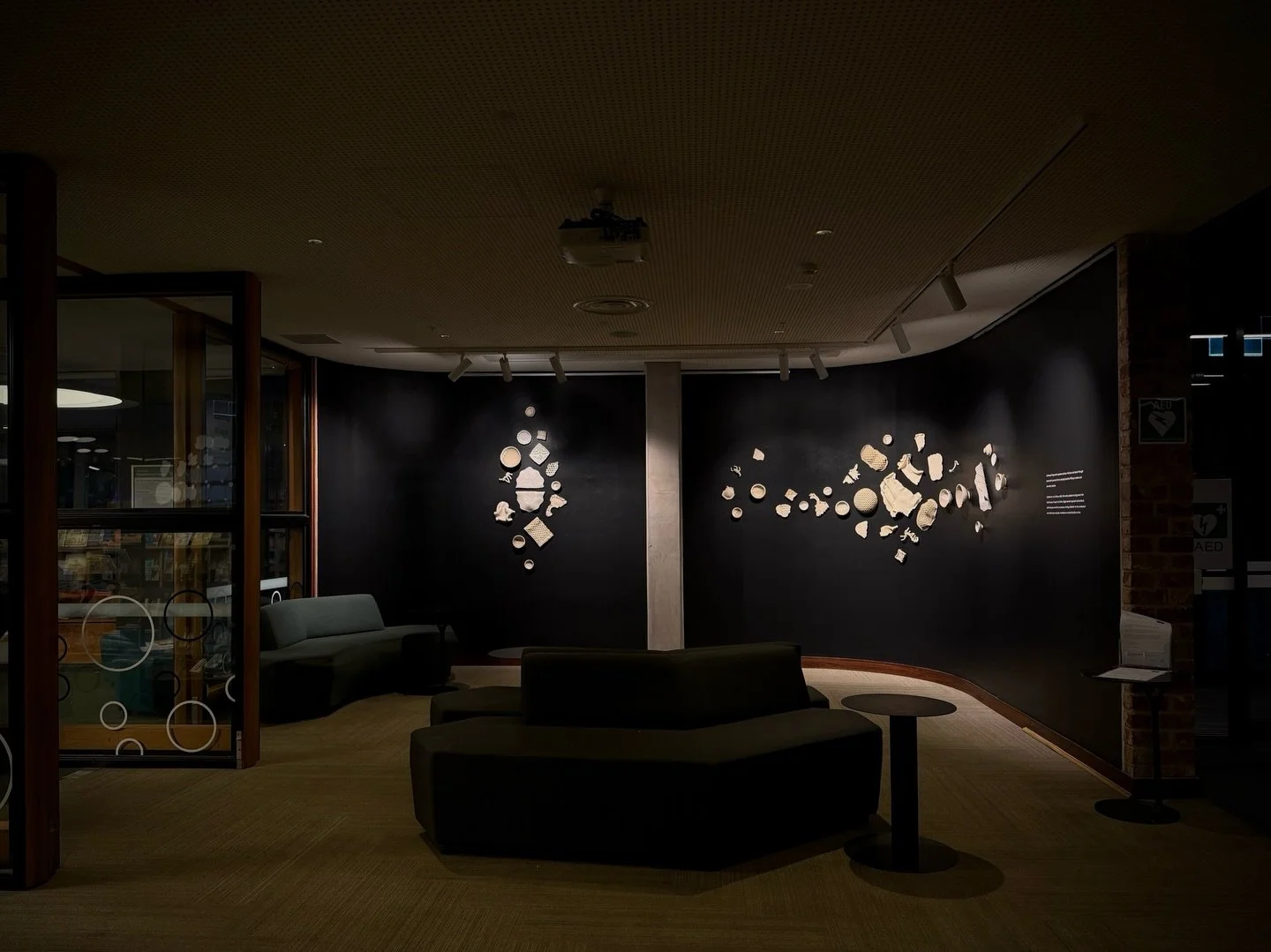 Gathered Fragments

A new installation bringing together hand-built ceramic forms shaped through accumulation, fracture, repair and surface.

Installed across the curved walls of Bargoonga Nganjin, the work draws from fragments, textures and overlook