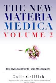 Book cover titled 'The New Materia Medica Volume 2' by Colin Griffith, featuring a small illustration of a flower with pink petals and green leaves.