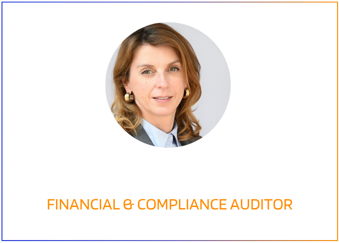 A woman with shoulder-length light brown hair, wearing a light blue collared shirt, gray blazer, and gold earrings, standing against a colorful graphic background with a cityscape silhouette and text.