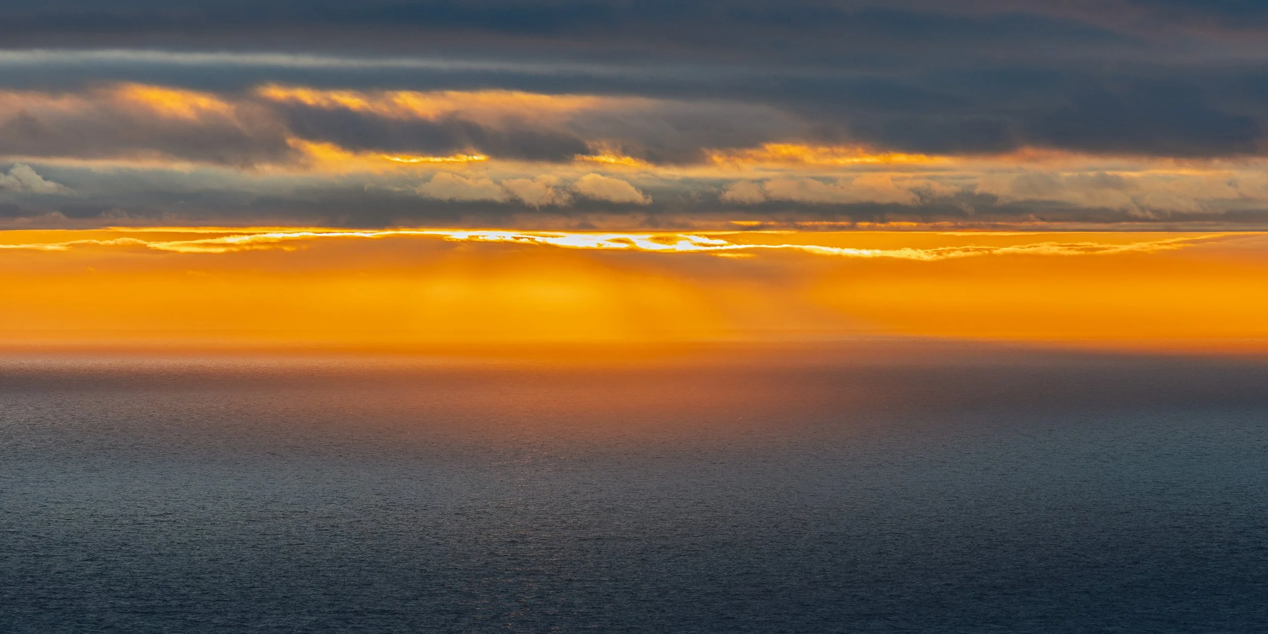 Minimalist sunset off the South Purbeck Jurassic Coat