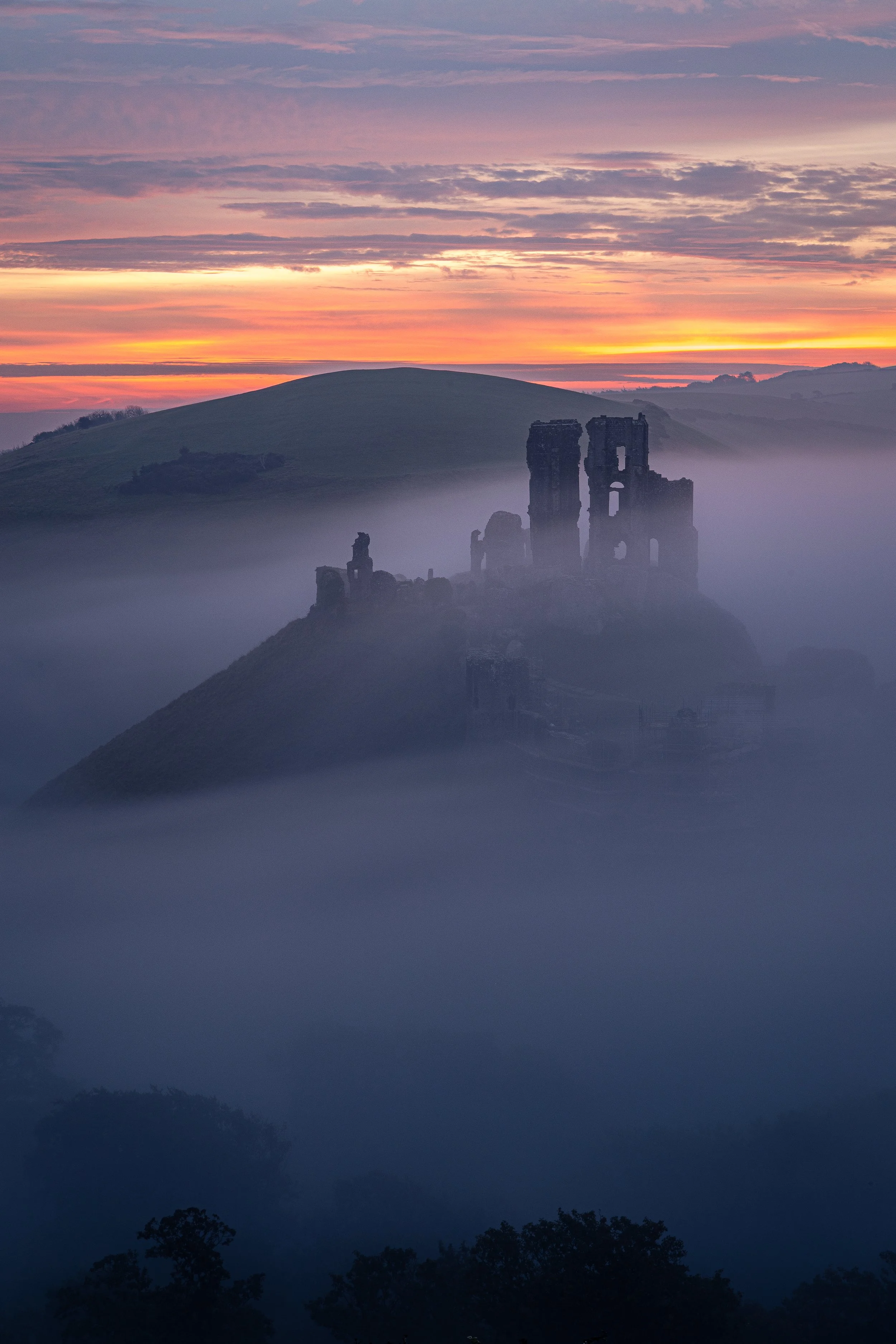 Corfe Castle misty sunrise. 