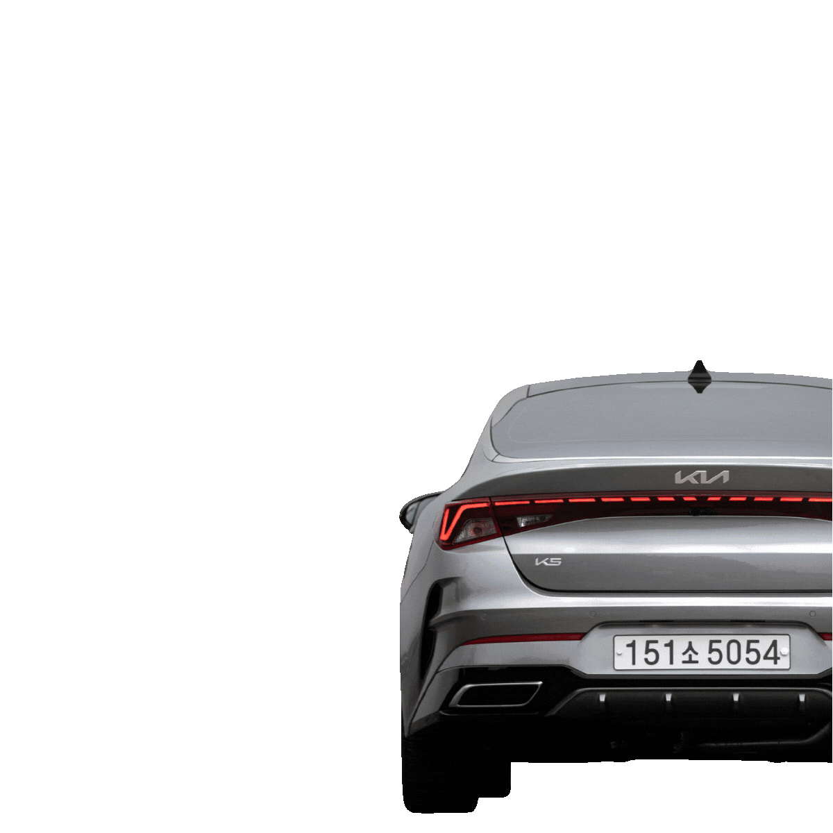 The rear view of a silver Kia K5 car against a plain light blue background.